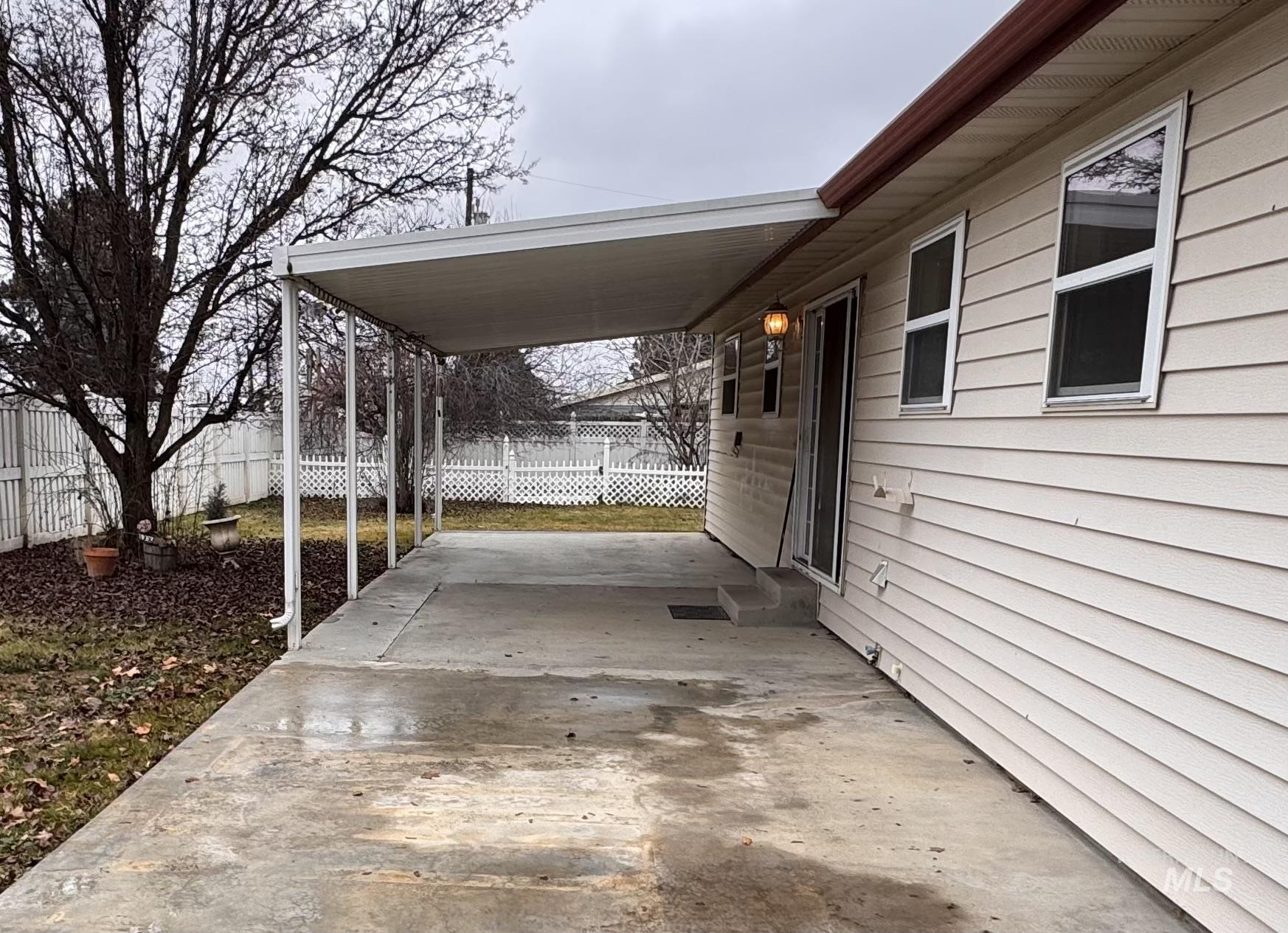 View of patio / terrace featuring a carport