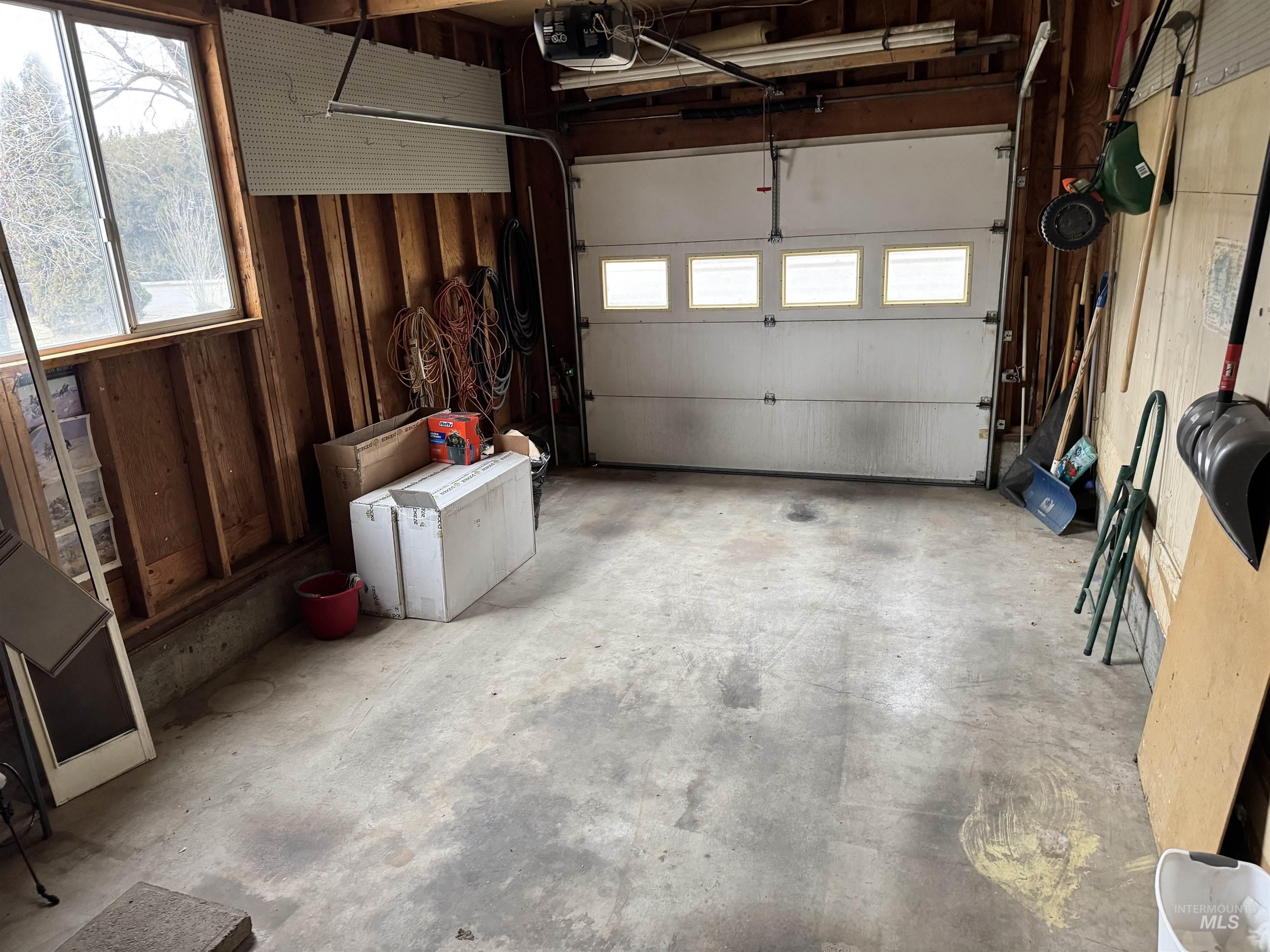 Garage featuring a garage door opener
