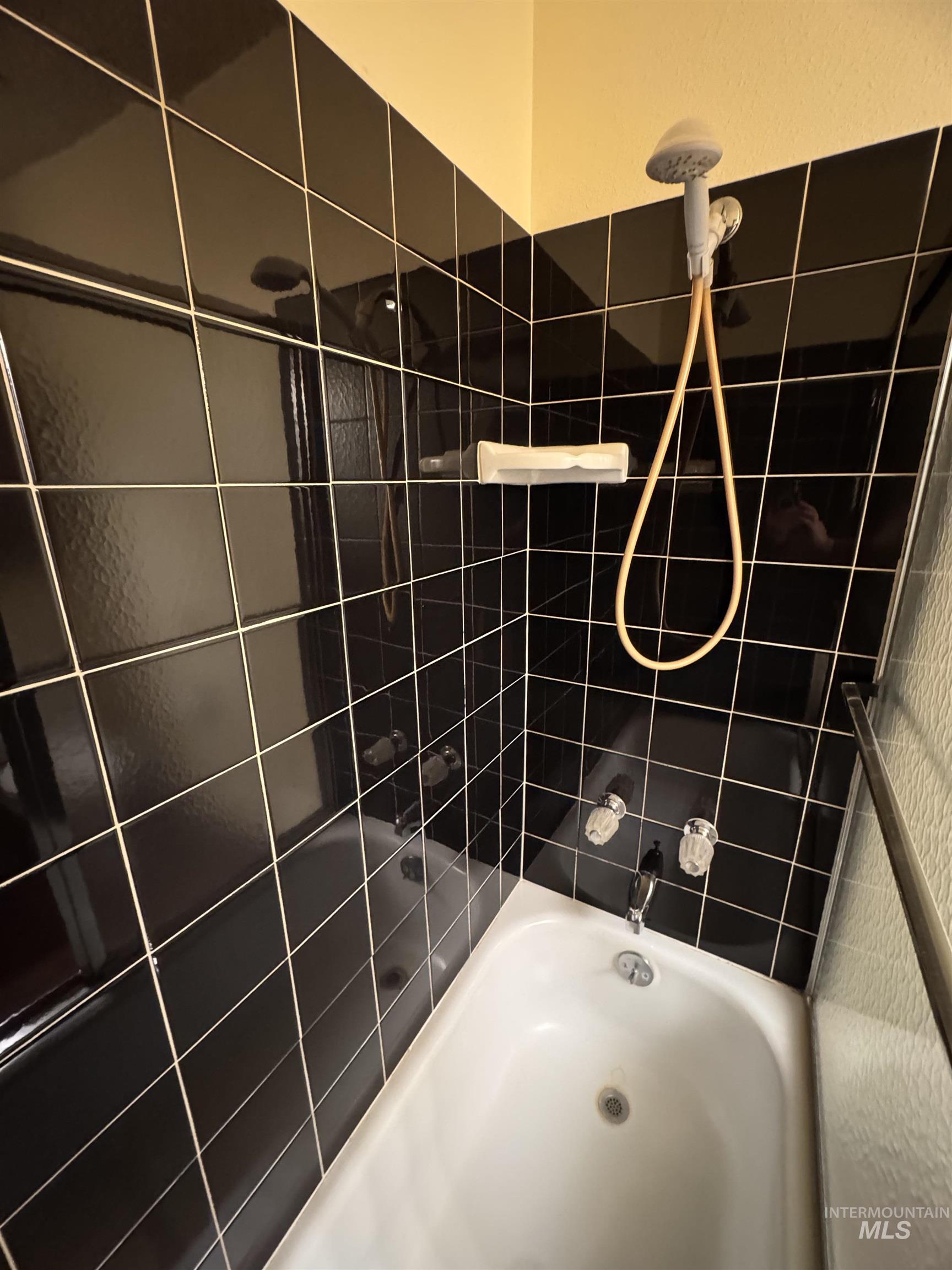 Full bathroom featuring shower / tub combination