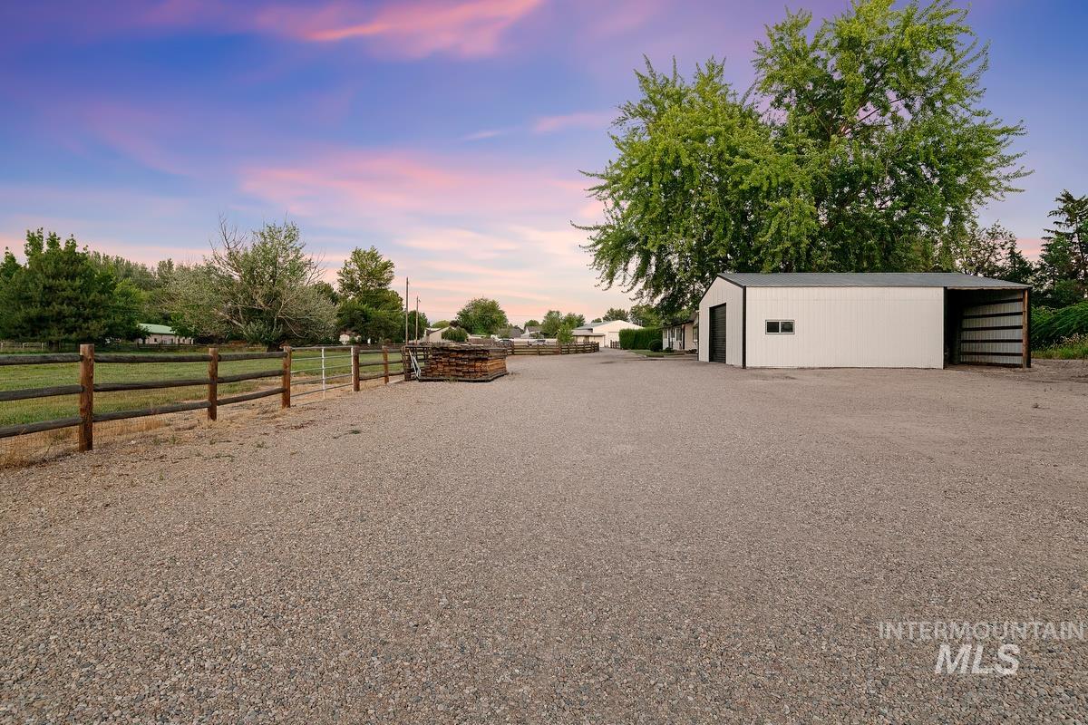 View of yard featuring an outbuilding and a pole building
