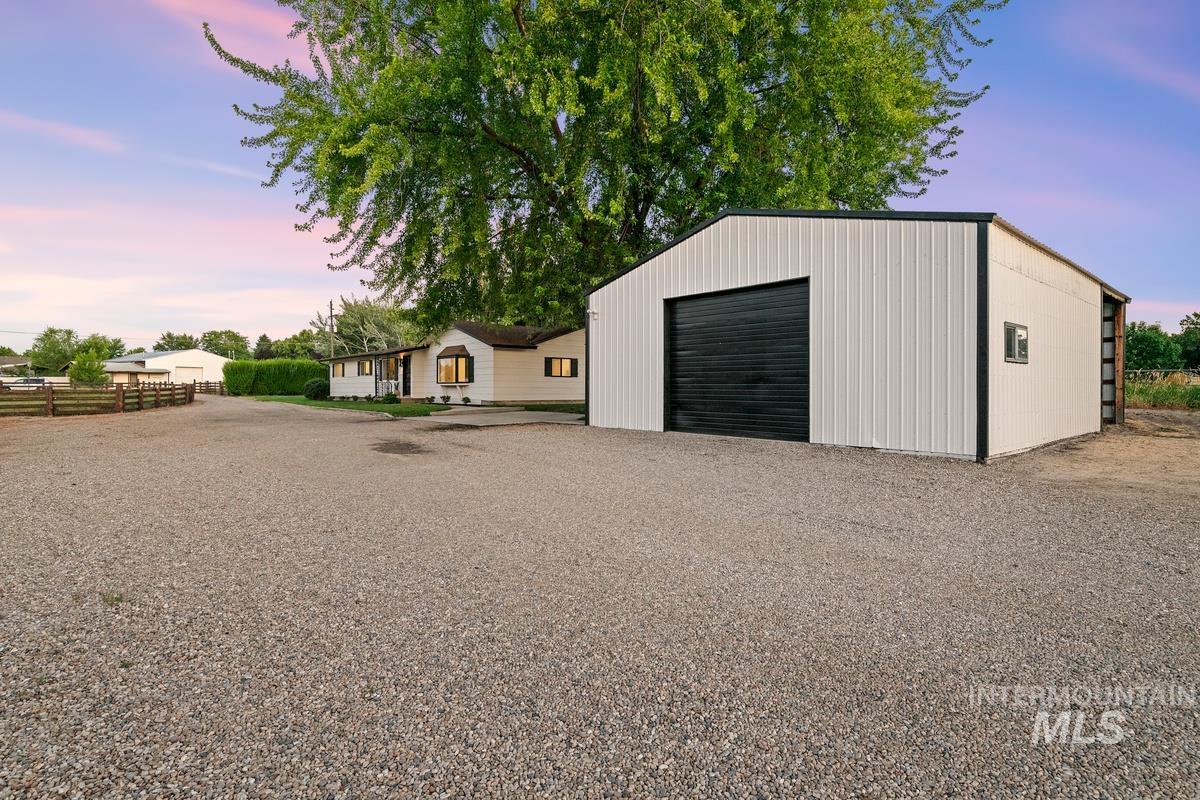 View of outbuilding with driveway