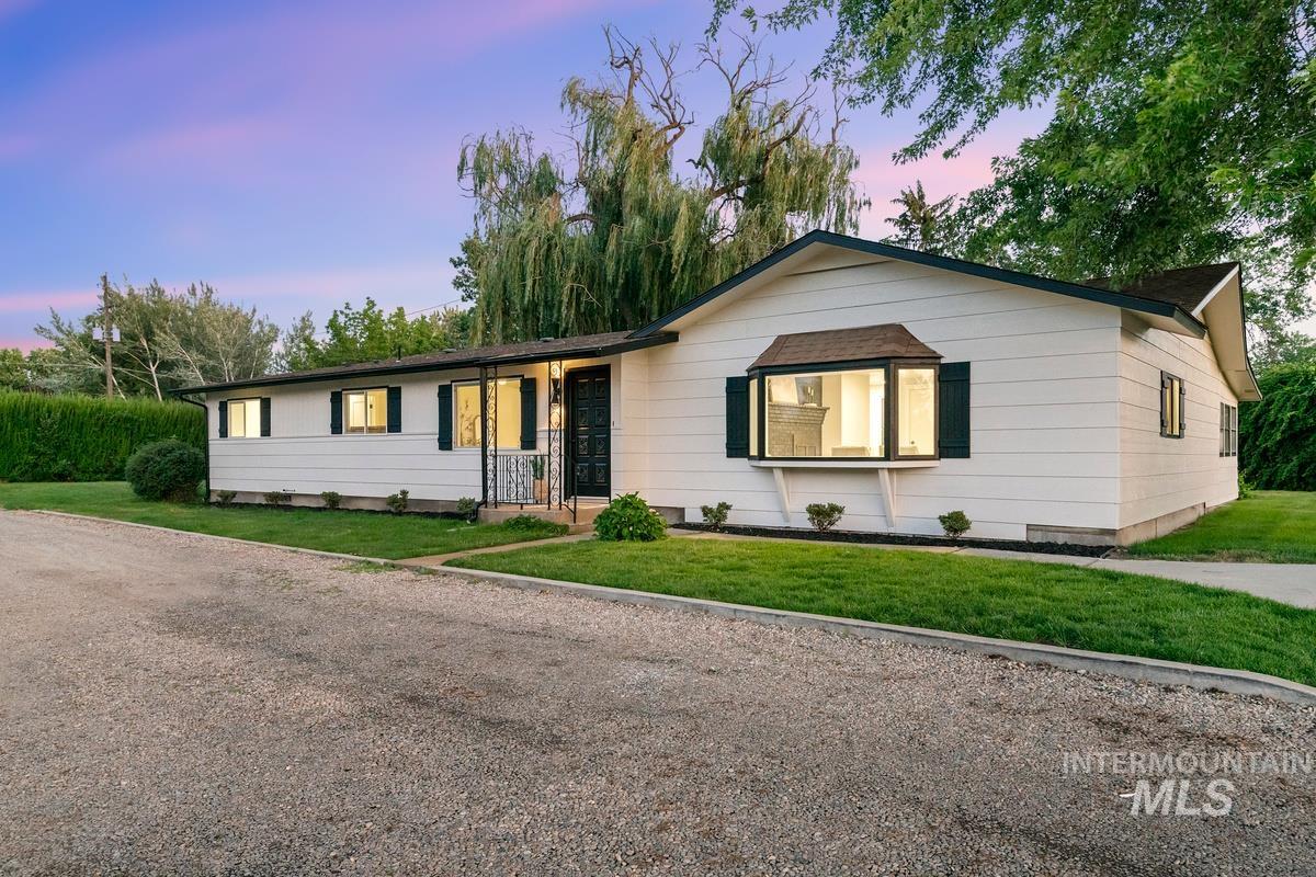 Ranch-style home with a front lawn