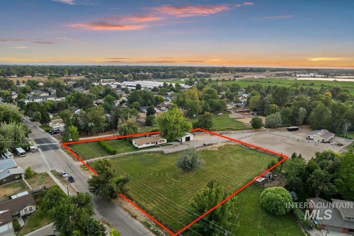 Aerial view at dusk of property boundaries highlighted and a view of rural / pastoral area