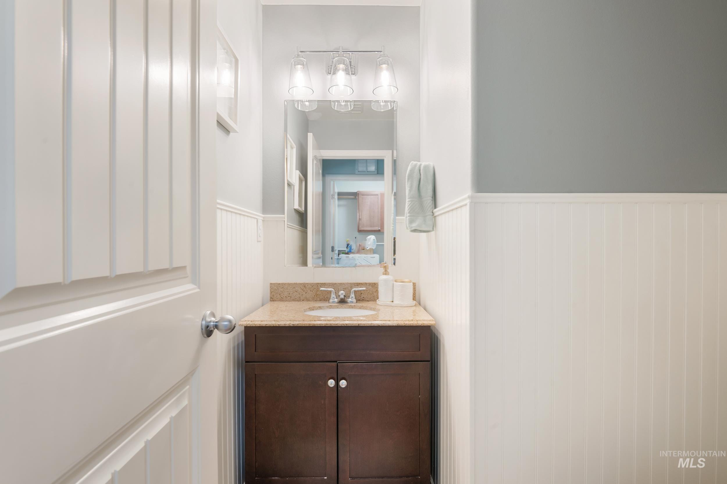 Bathroom featuring vanity and wainscoting