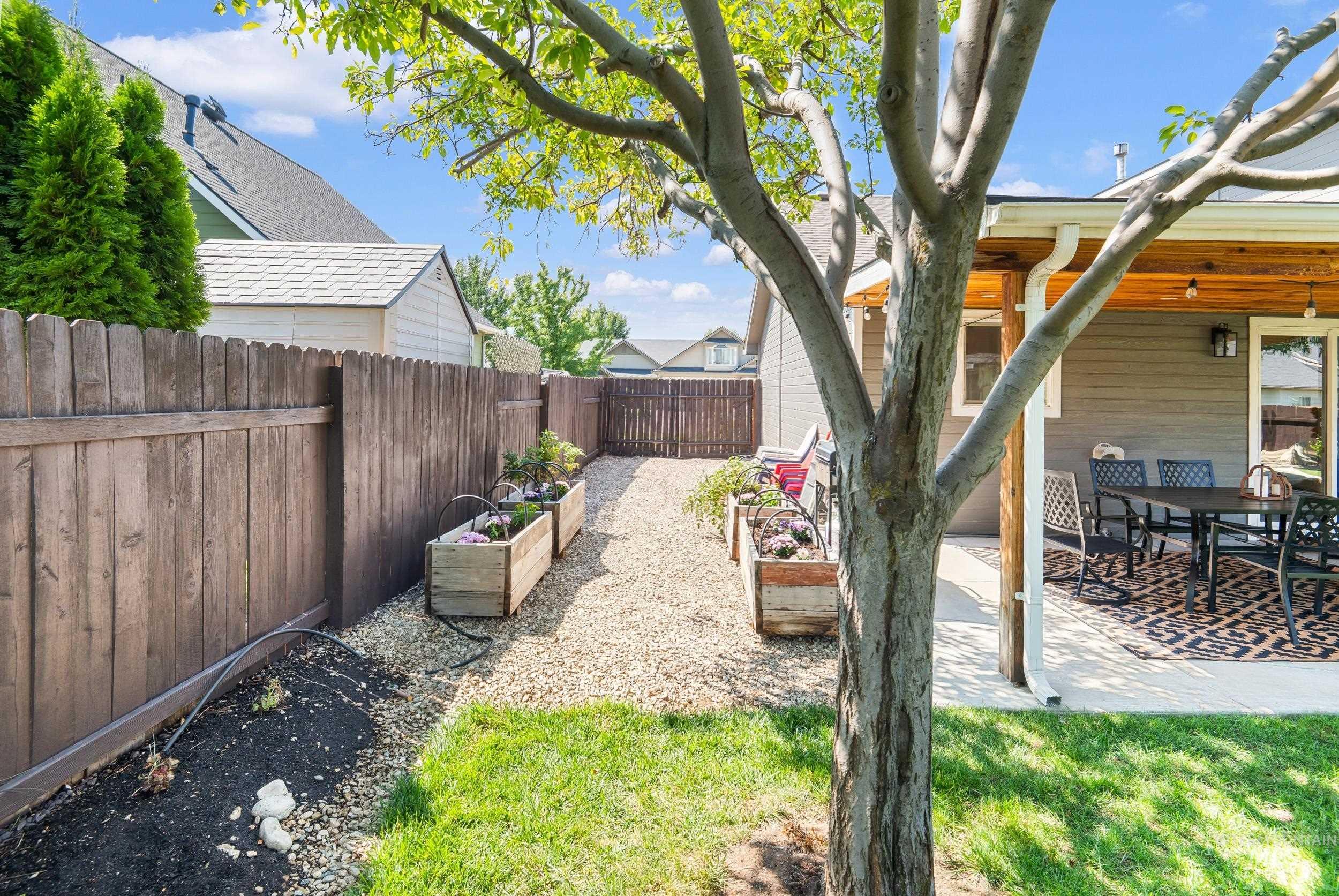 View of yard with a garden and a patio area