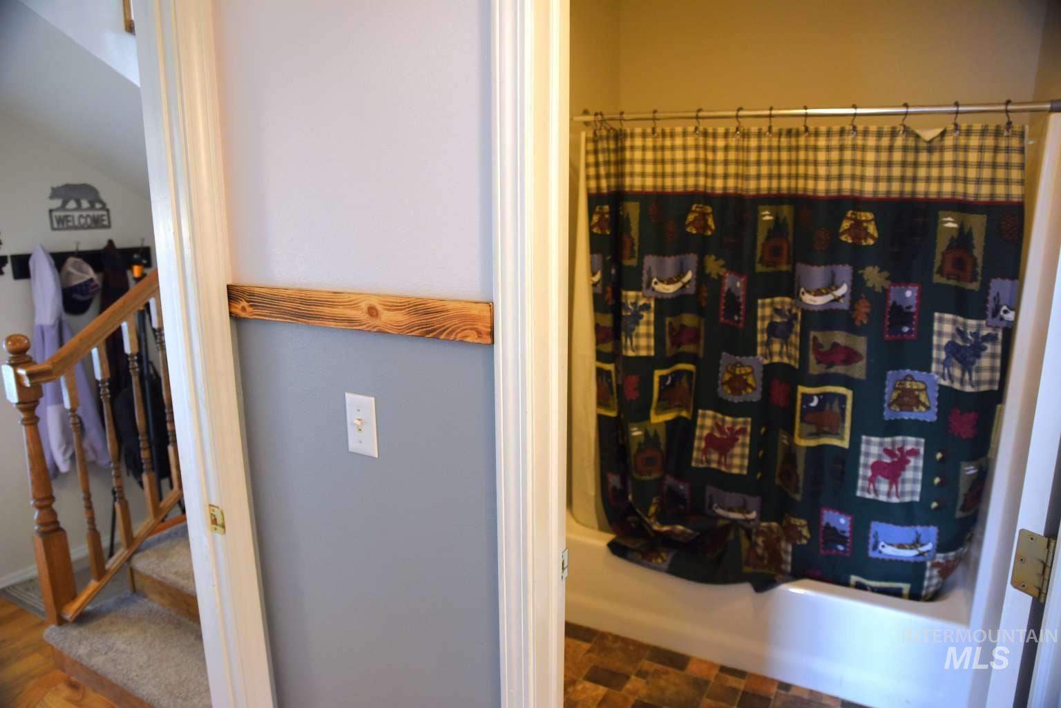 Bathroom featuring shower / bath combination with curtain