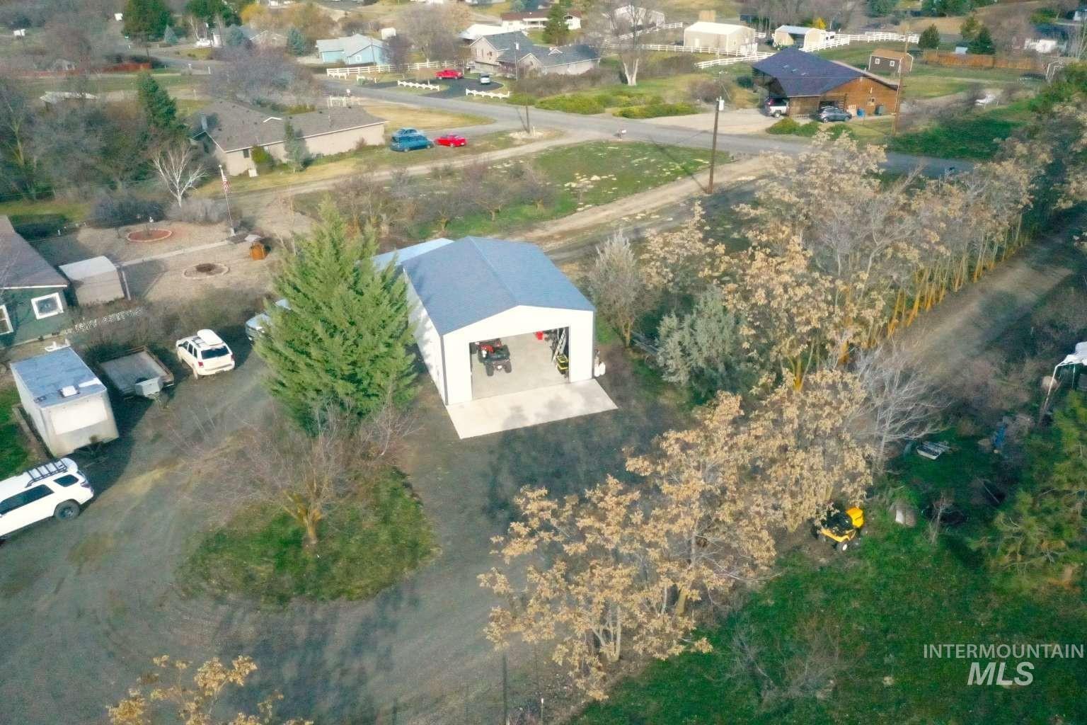 Aerial overview of property's location with nearby suburban area