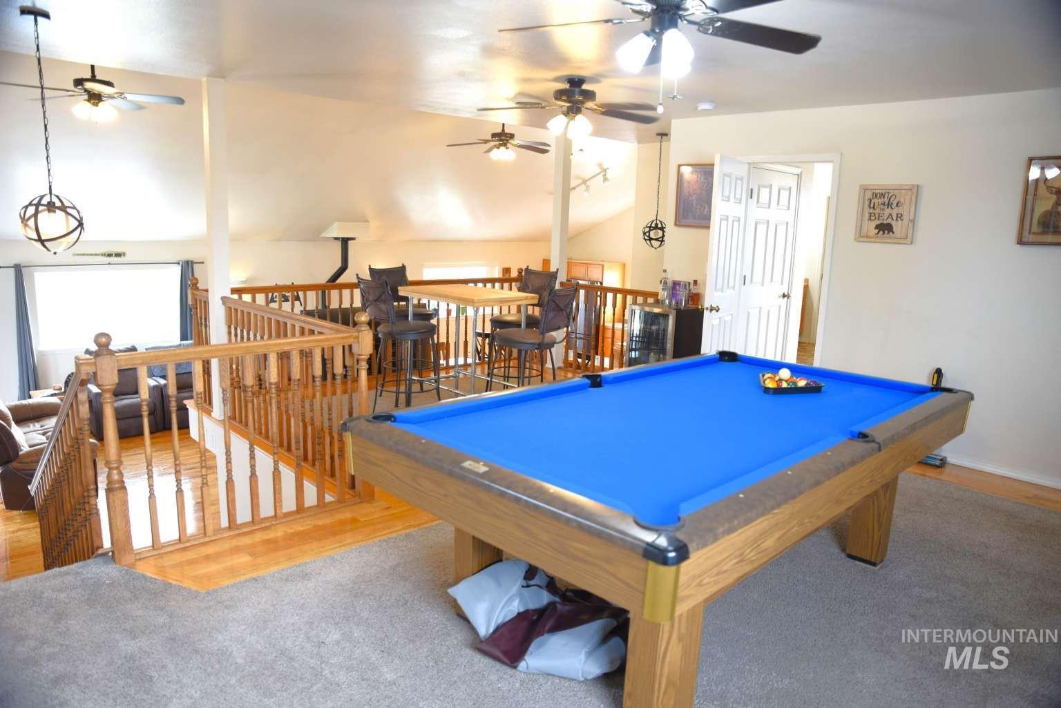 Rec room with pool table, vaulted ceiling, and a ceiling fan
