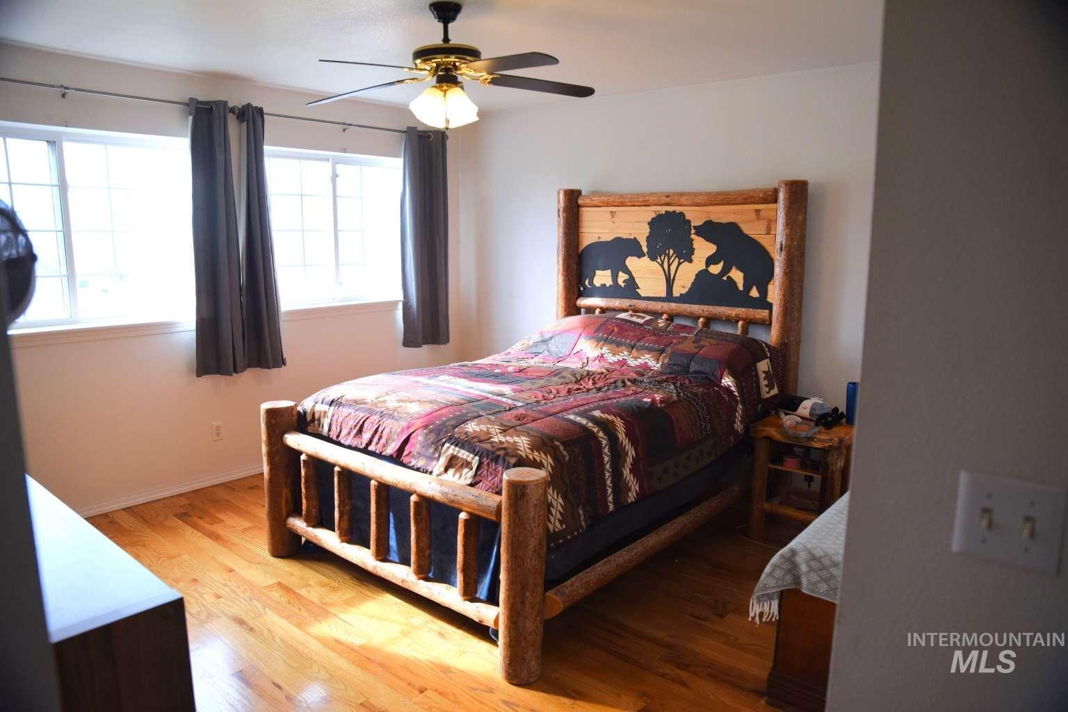 Bedroom featuring light wood finished floors and ceiling fan