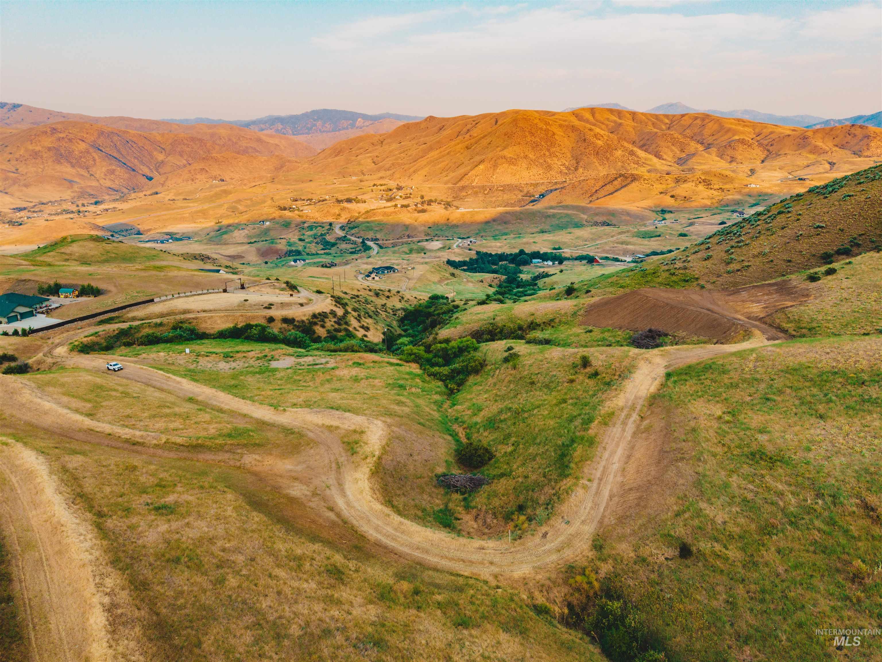 Aerial overview of property's location featuring mountains and rural landscape