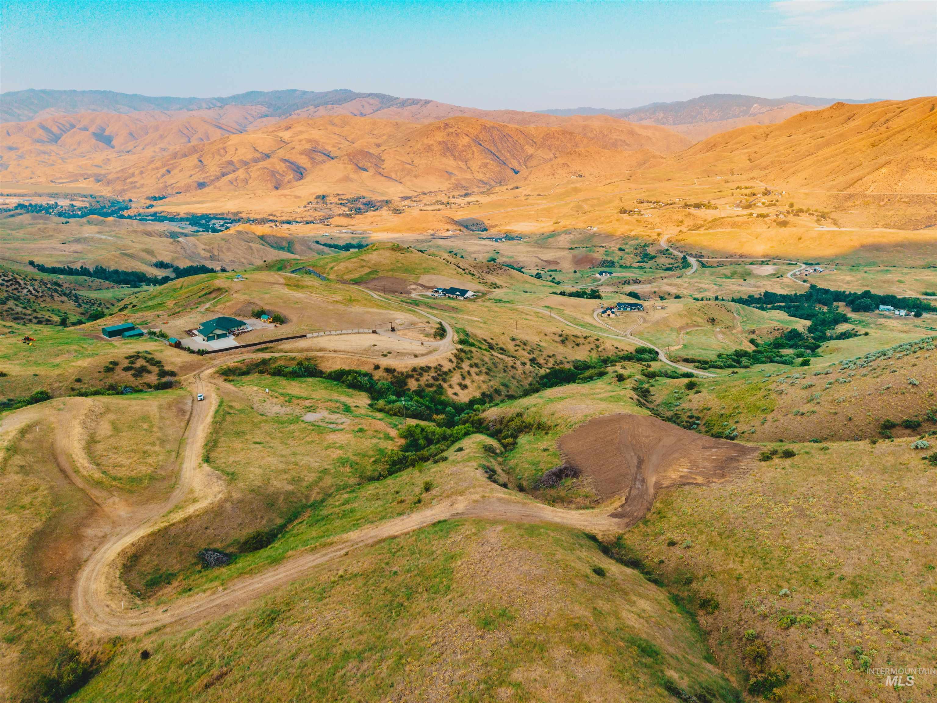 Aerial overview of property's location featuring mountains and rural landscape