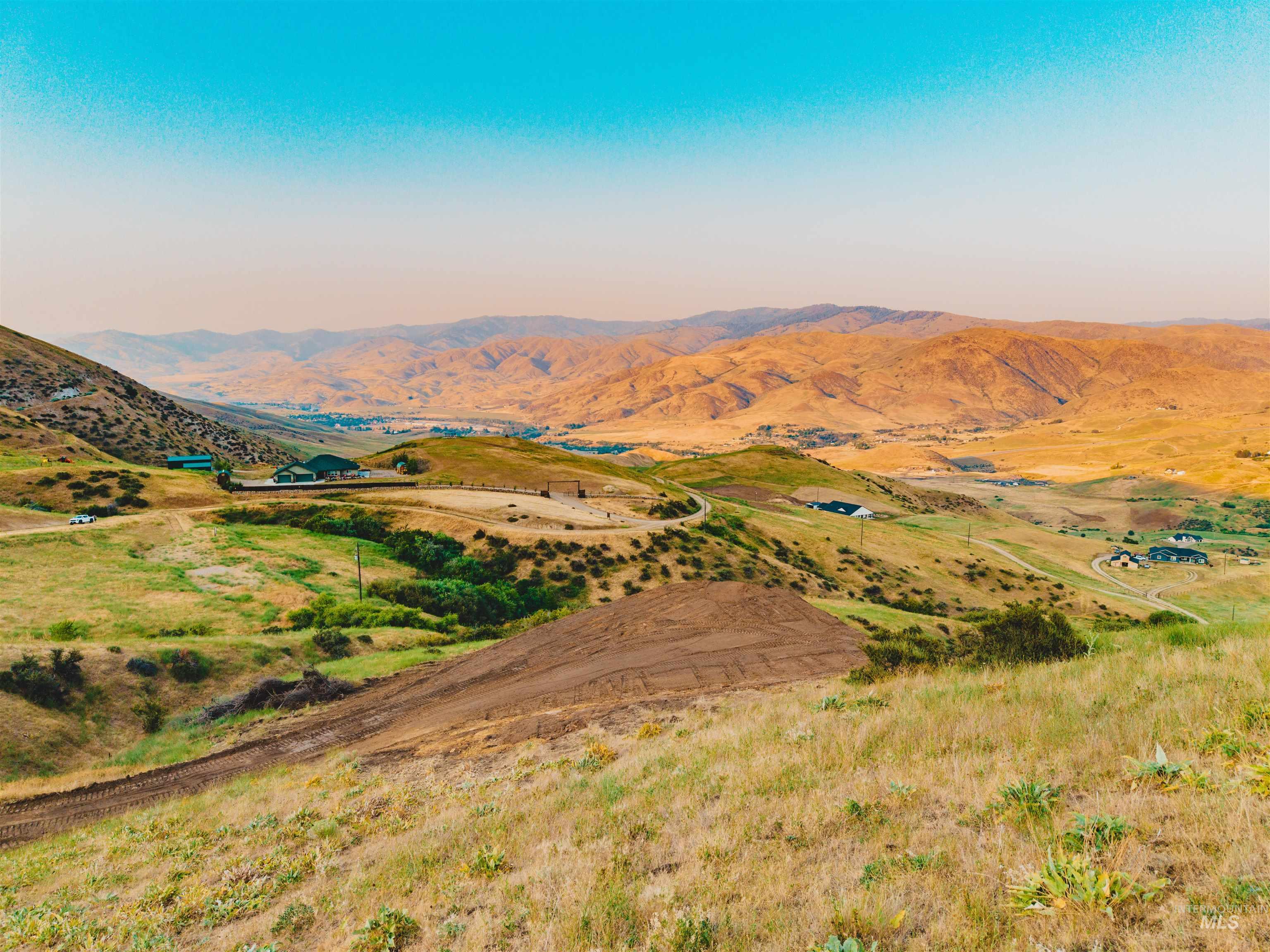 View of mountain backdrop featuring rural landscape