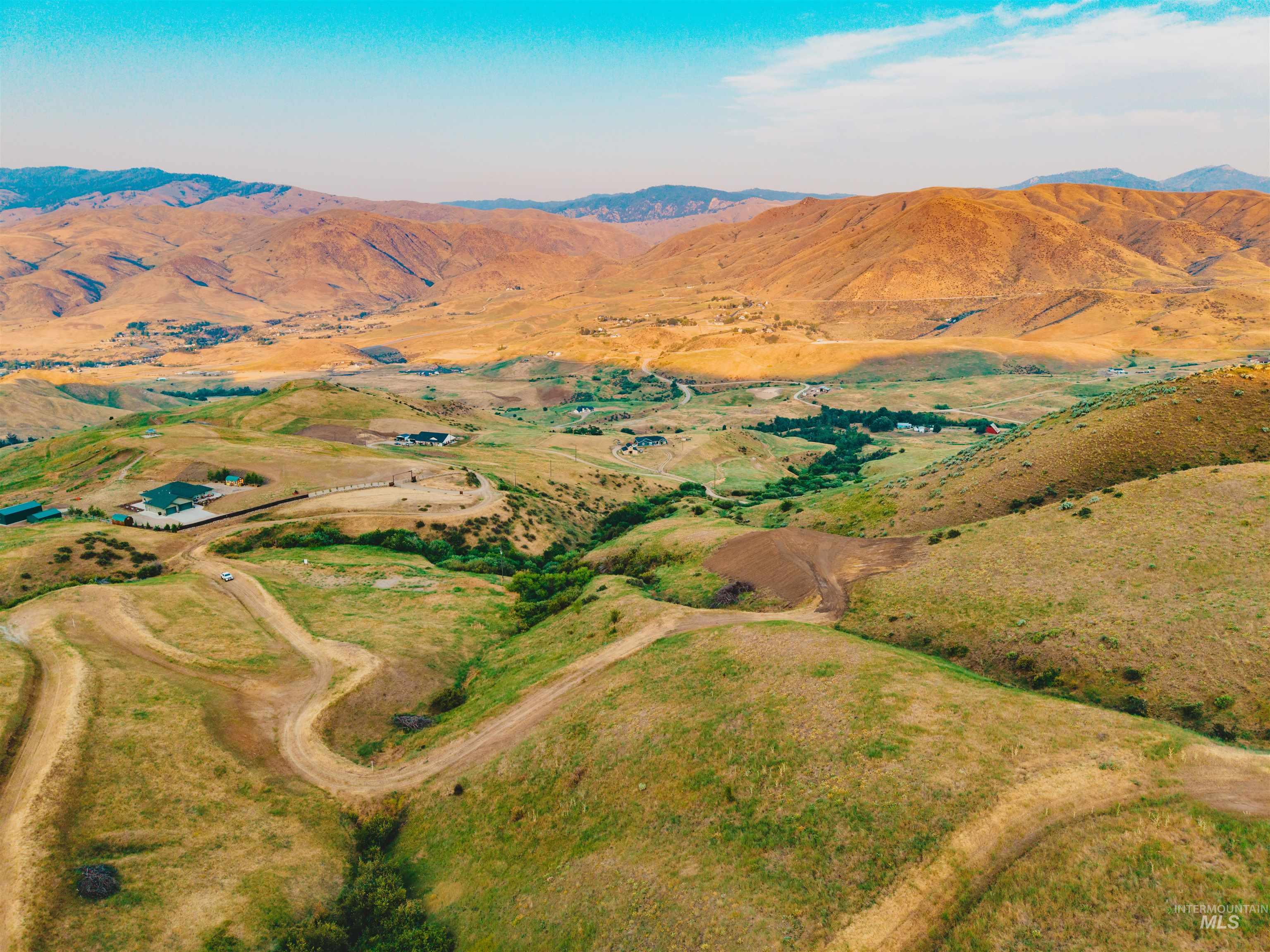 Aerial overview of property's location featuring a mountain backdrop