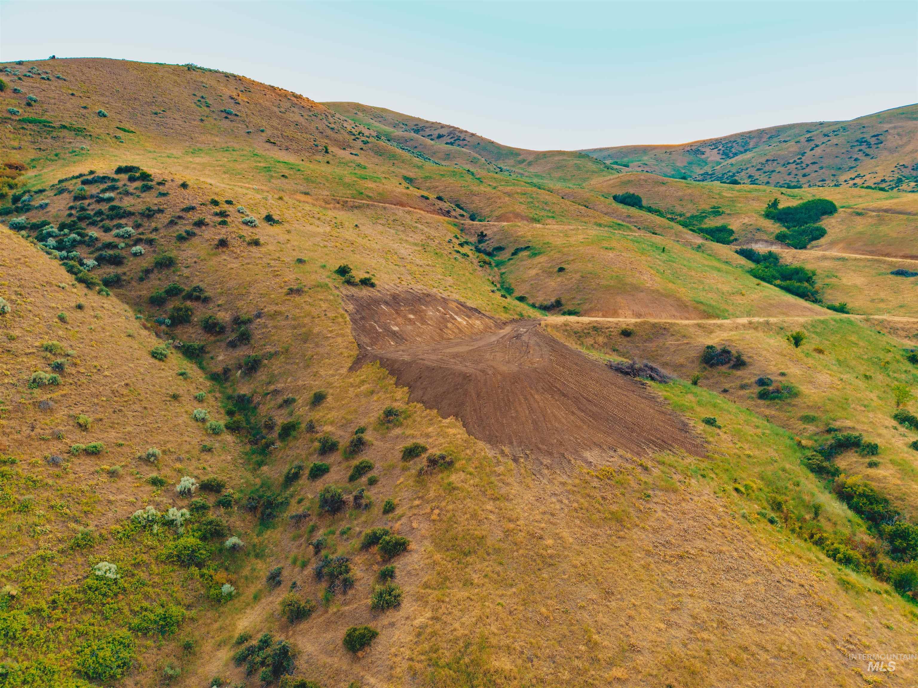 Aerial view of property and surrounding area with rural landscape