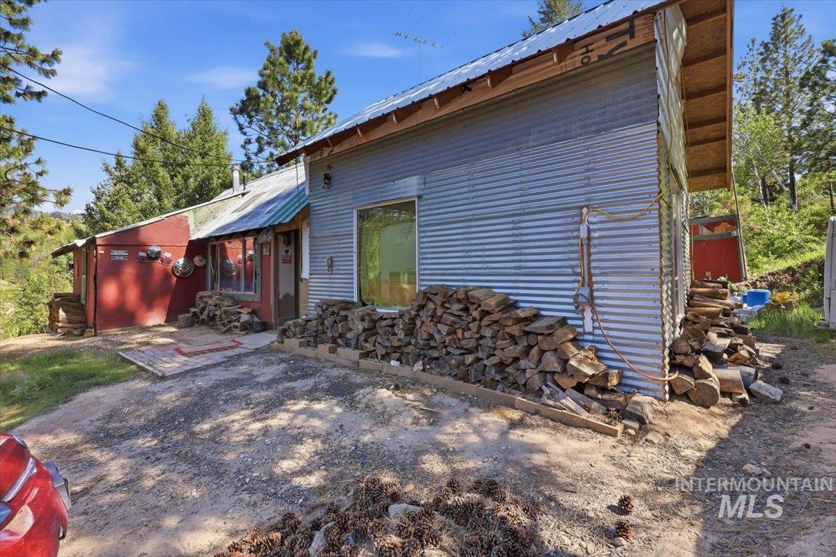 Corrugated metal siding facade with exposed wood eaves