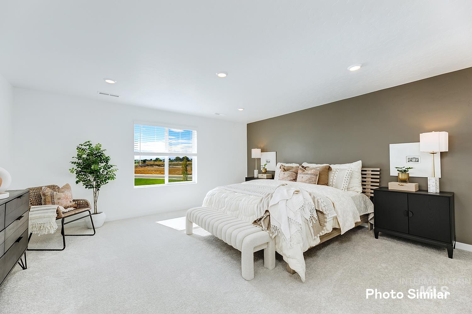 Bedroom featuring light carpet and recessed lighting
