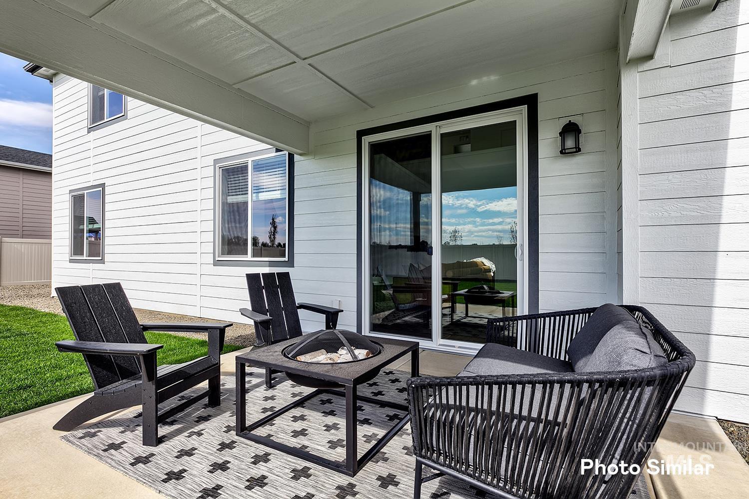 View of patio with a fire pit