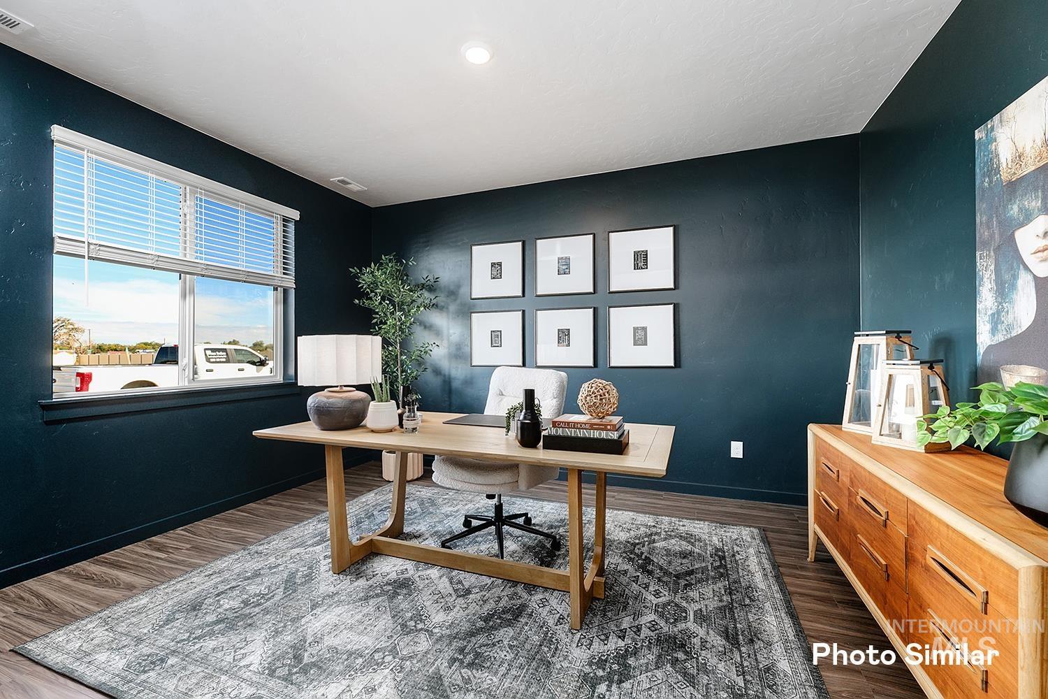 Office featuring dark wood-style flooring and baseboards
