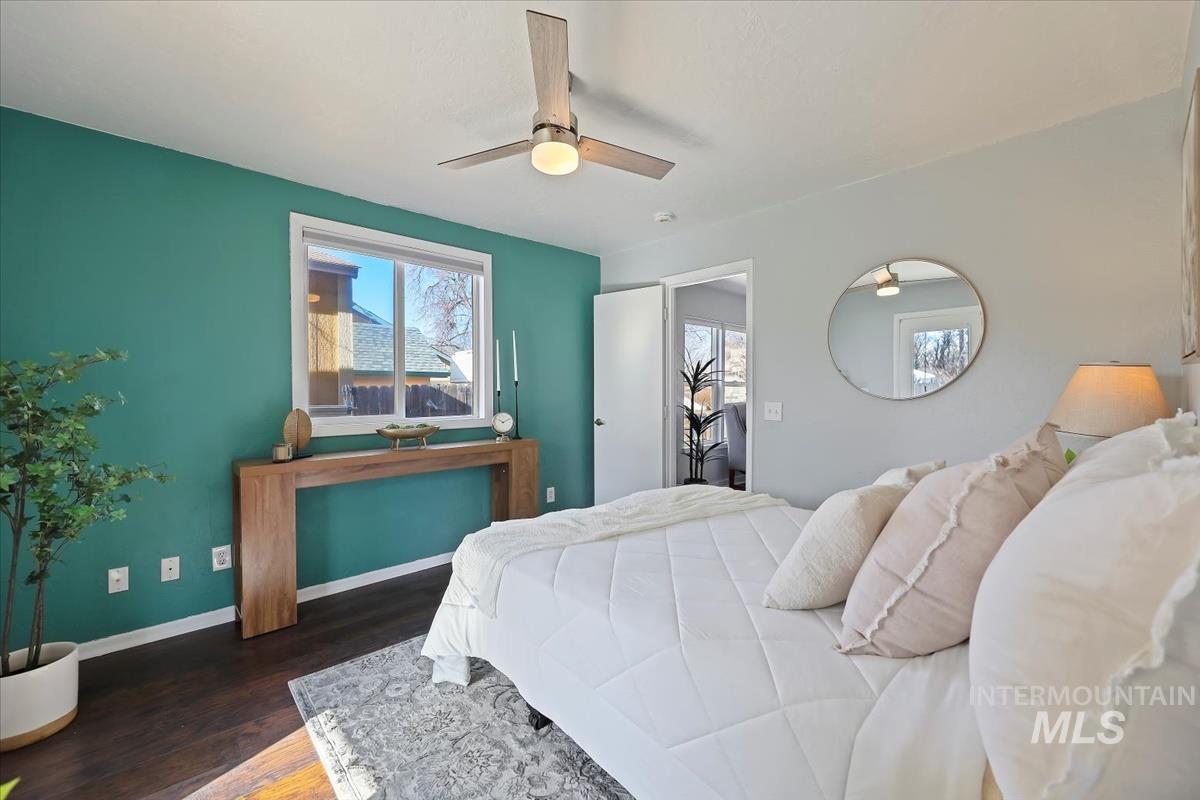 Bedroom with wood finished floors and a ceiling fan