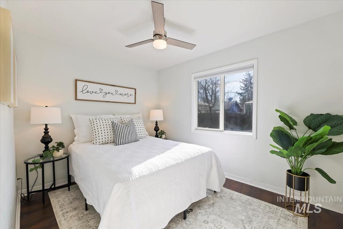 Bedroom with wood finished floors and a ceiling fan