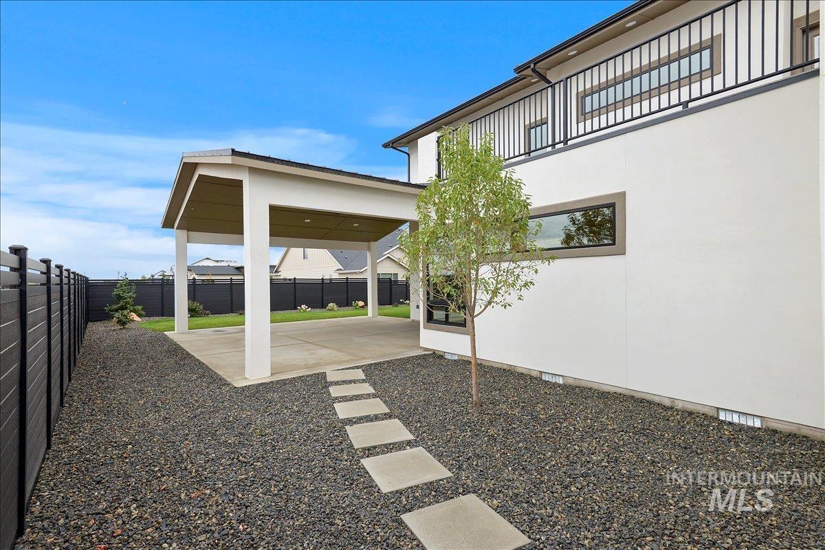 Fenced backyard with a patio area