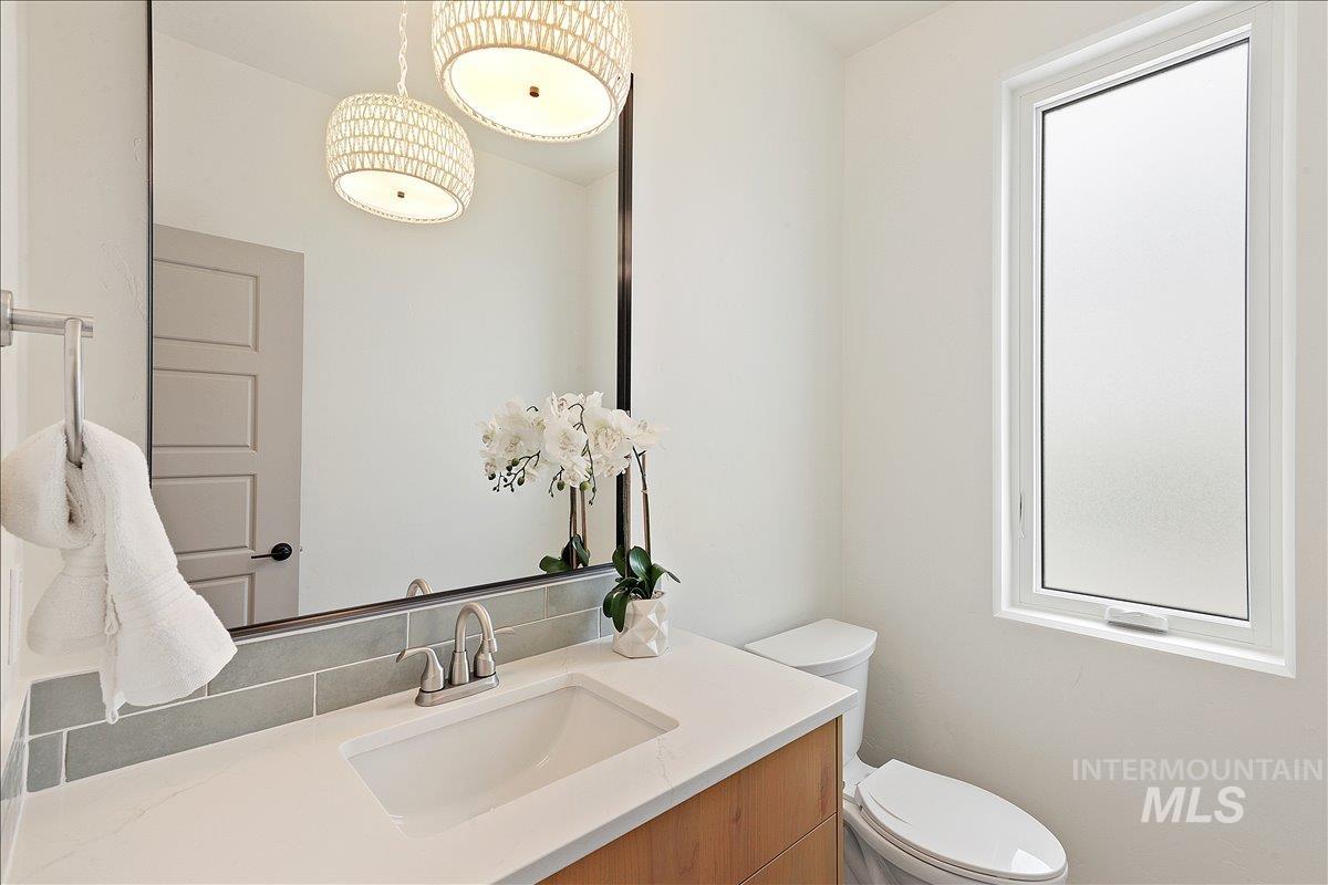 Half bath with vanity and toilet