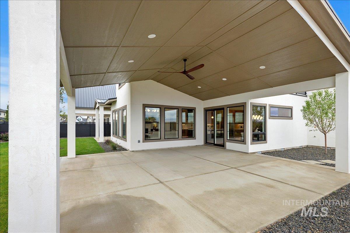 View of patio featuring ceiling fan
