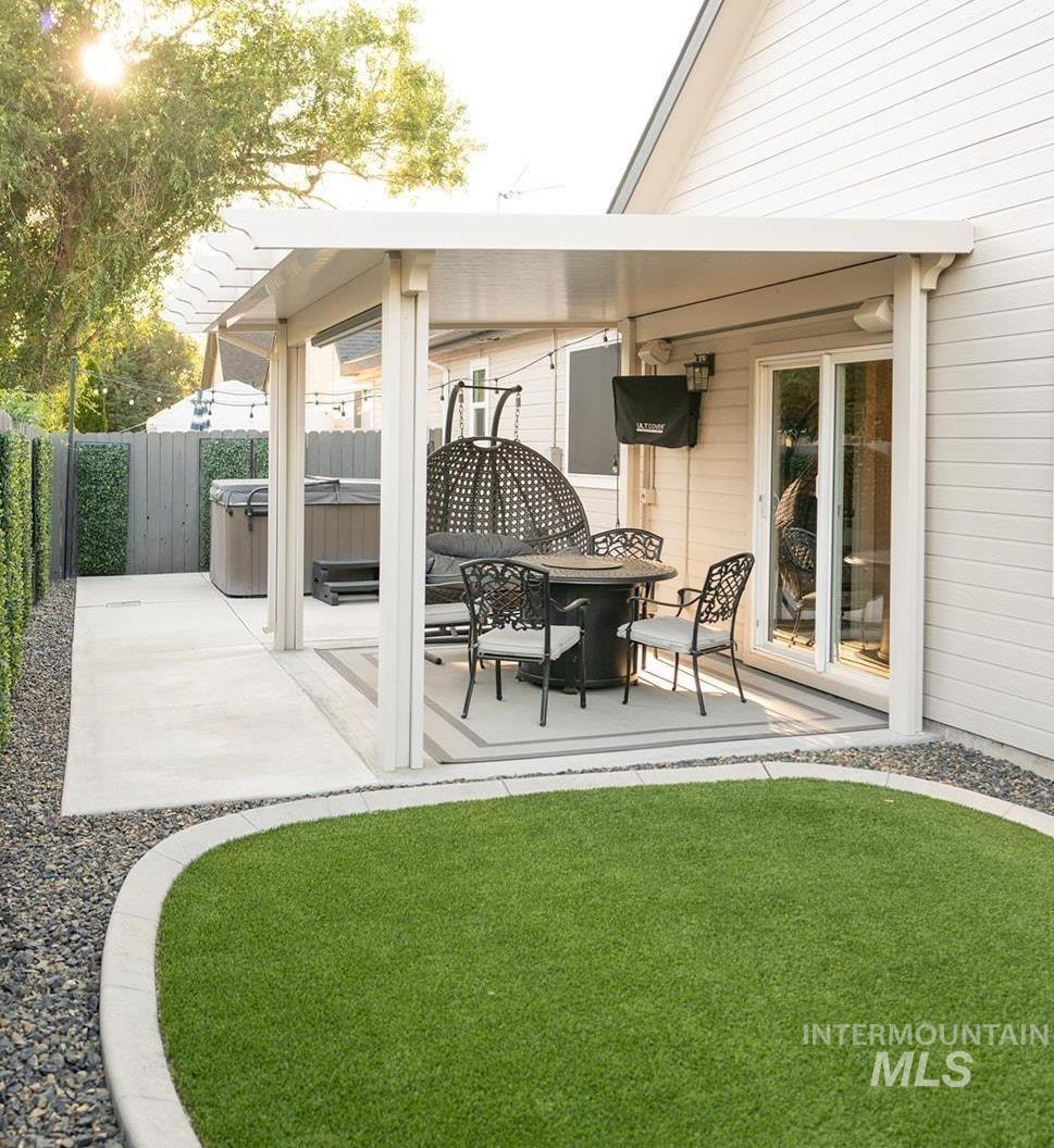 View of patio featuring a hot tub