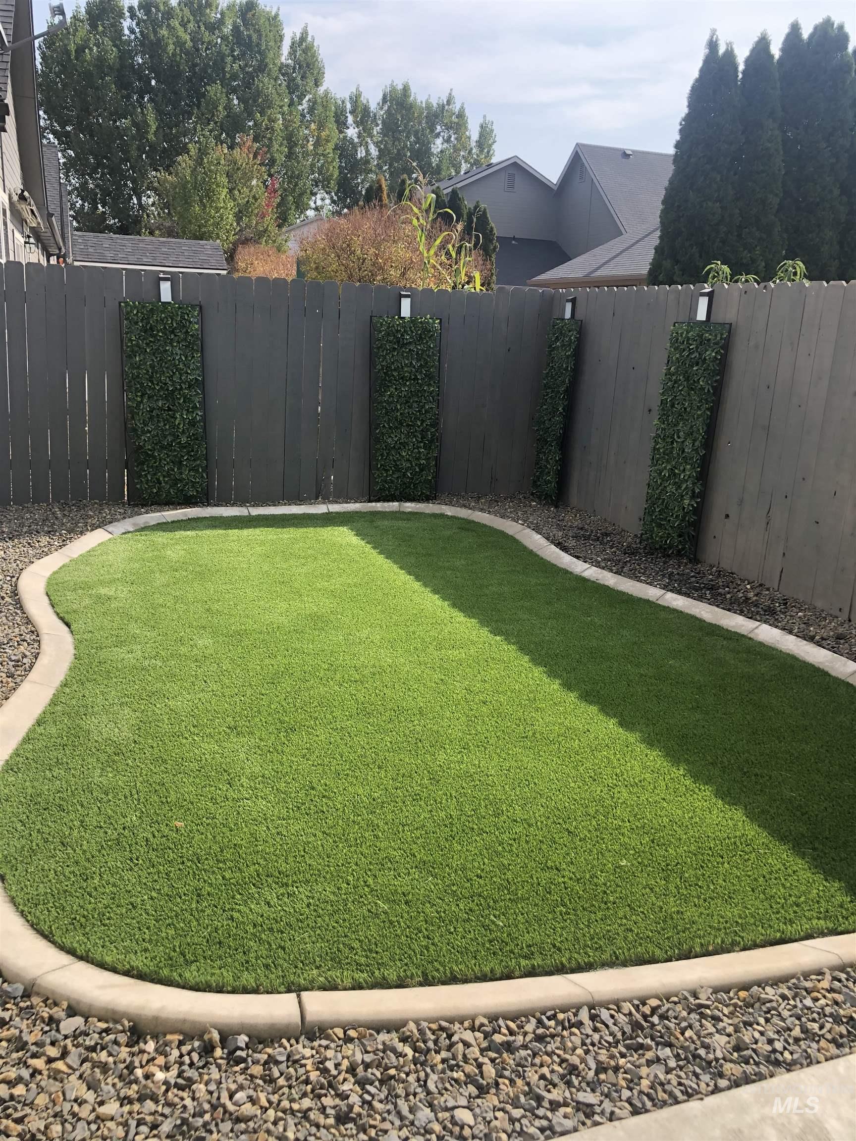 View of fenced backyard