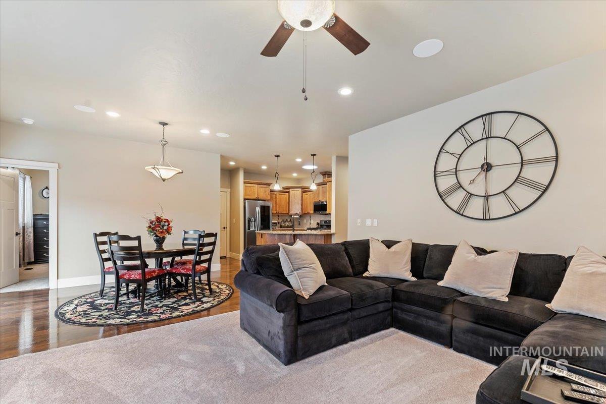 Living area featuring recessed lighting, light wood-type flooring, and ceiling fan