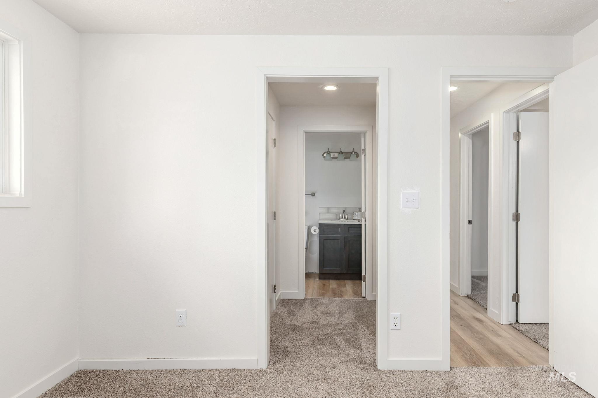 Unfurnished room with light colored carpet and recessed lighting