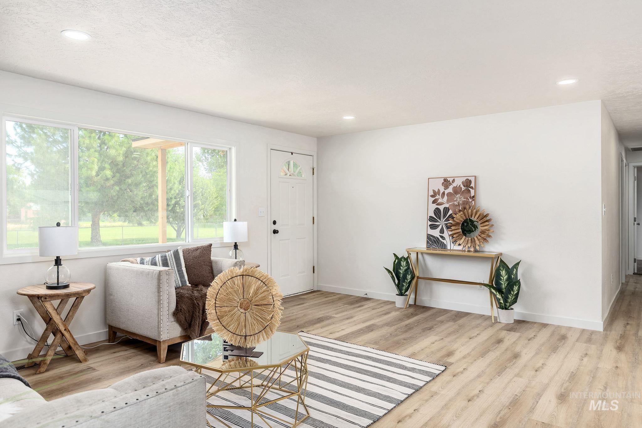 Living room featuring wood finished floors and recessed lighting