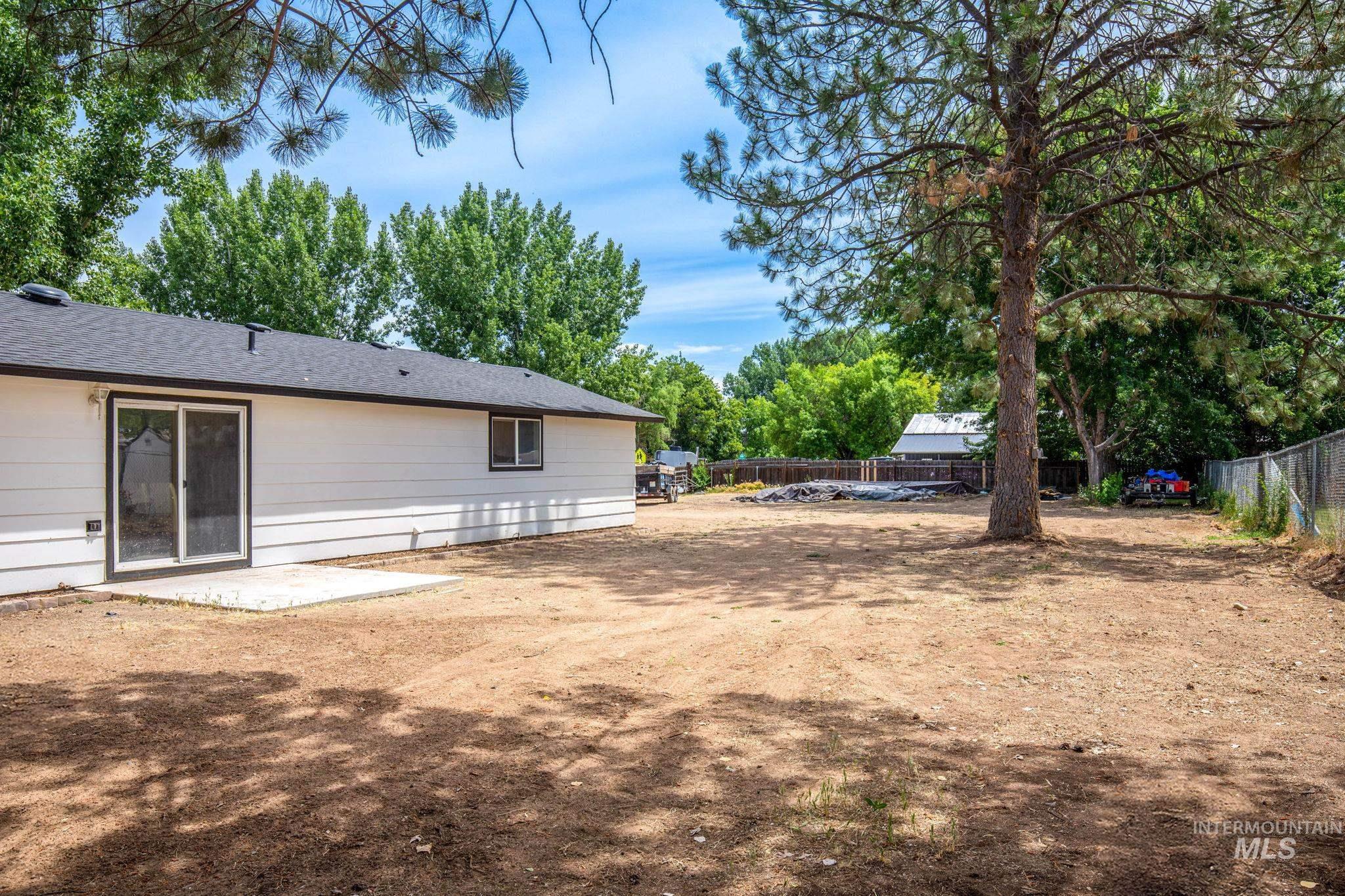 View of fenced backyard