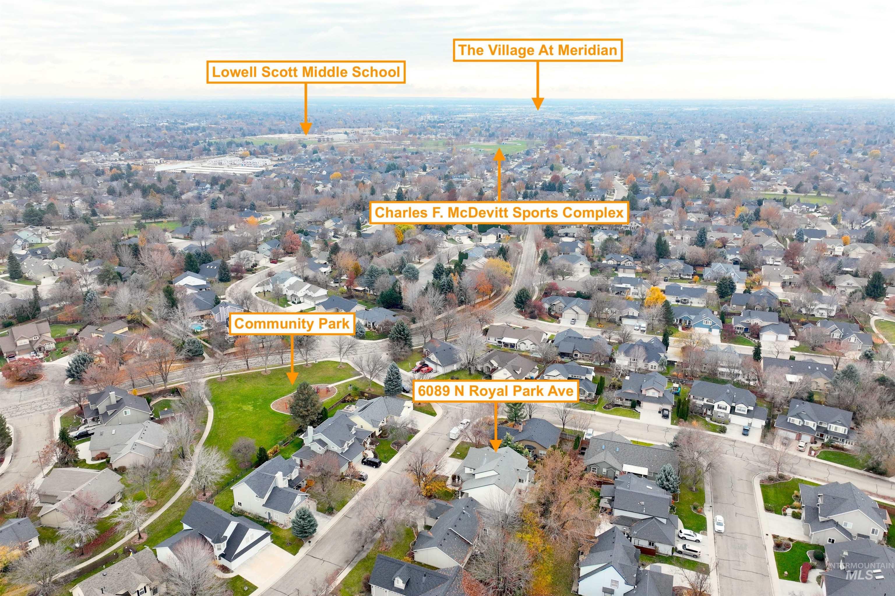 Aerial view of property's location featuring nearby suburban area