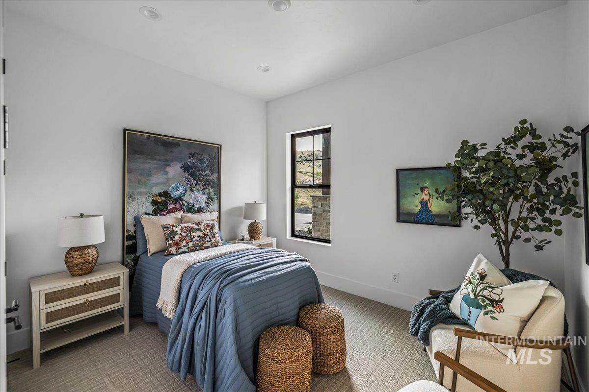 Bedroom with carpet flooring and baseboards