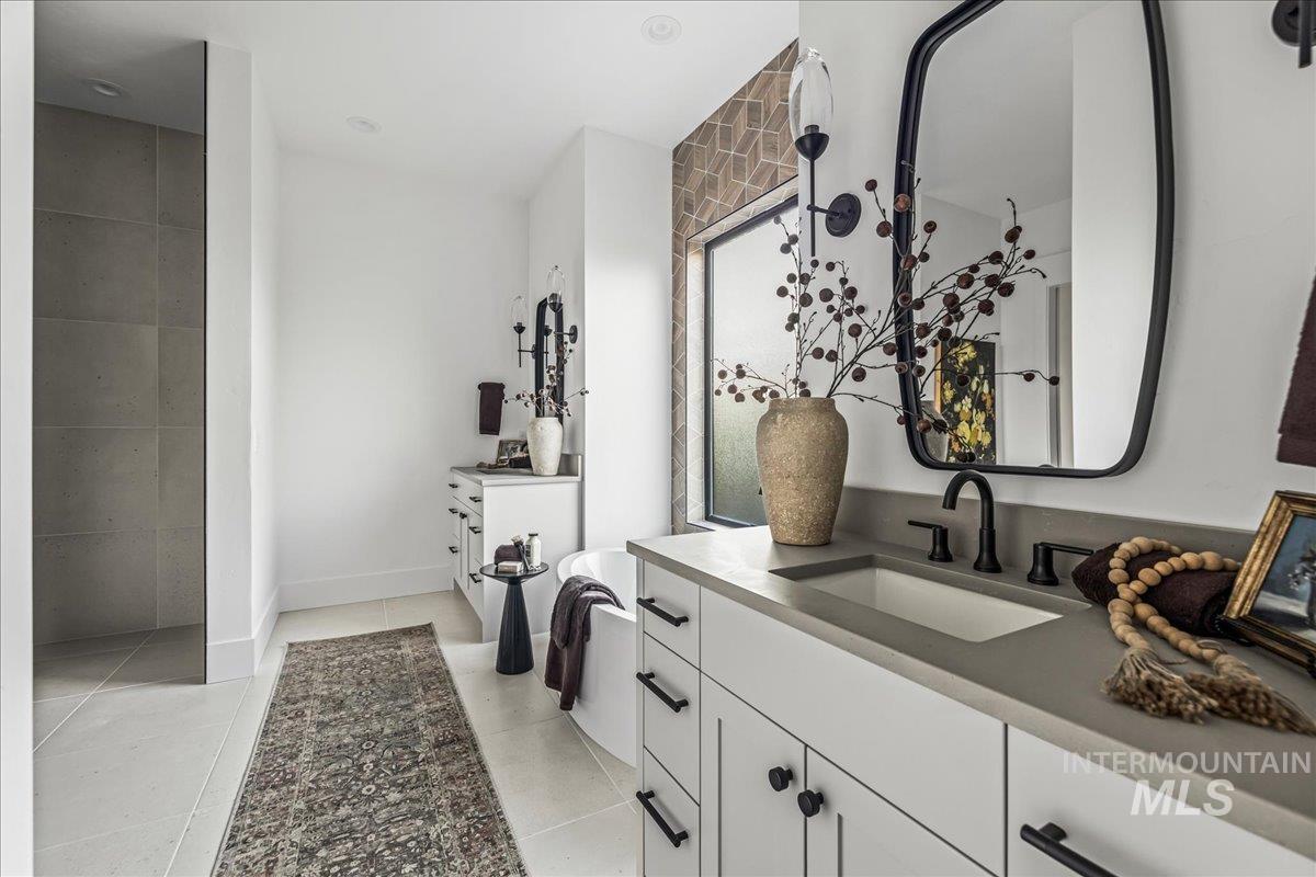 Bathroom featuring vanity and light tile patterned floors