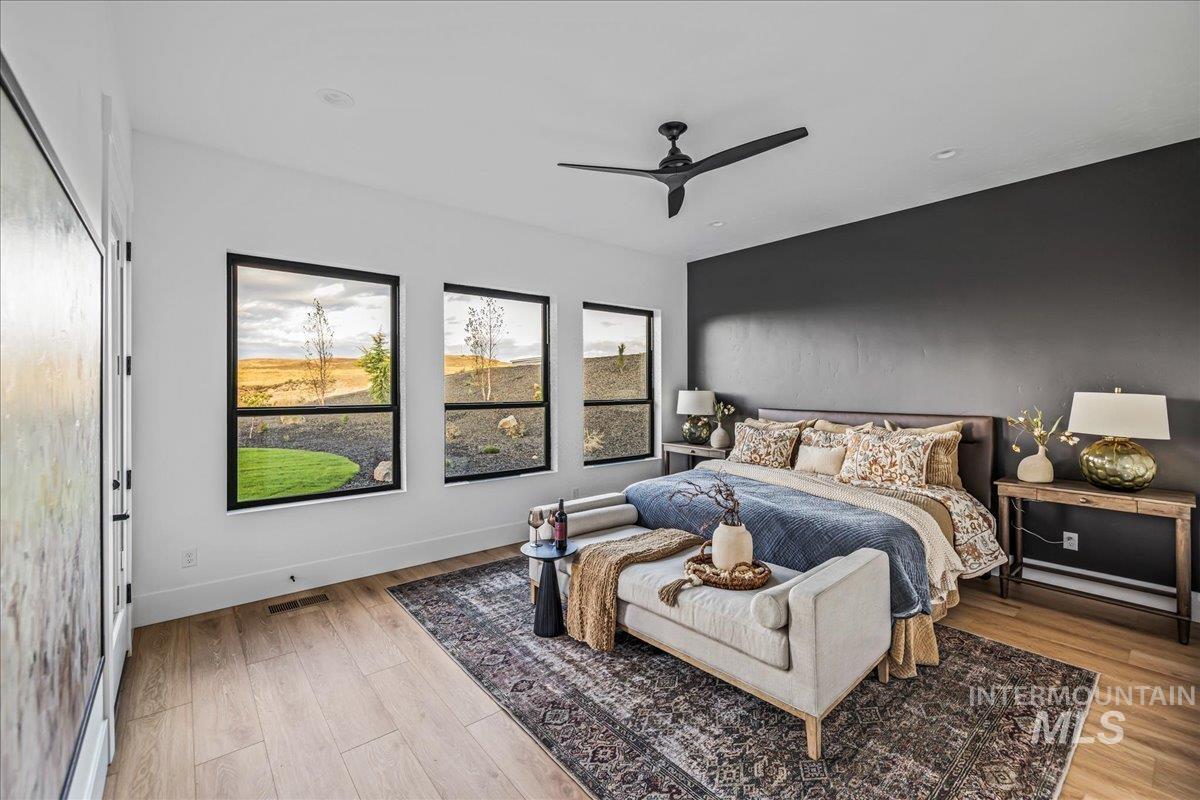 Bedroom featuring a ceiling fan and light wood finished floors