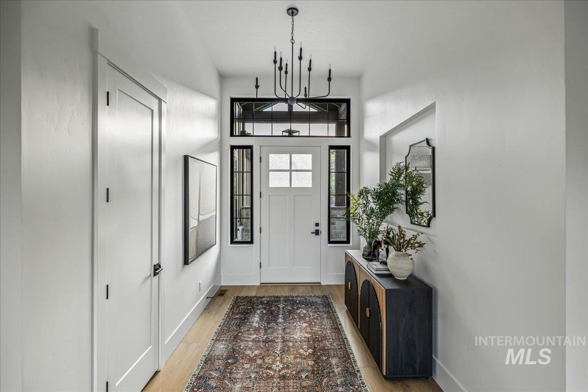 Foyer with light wood-style floors