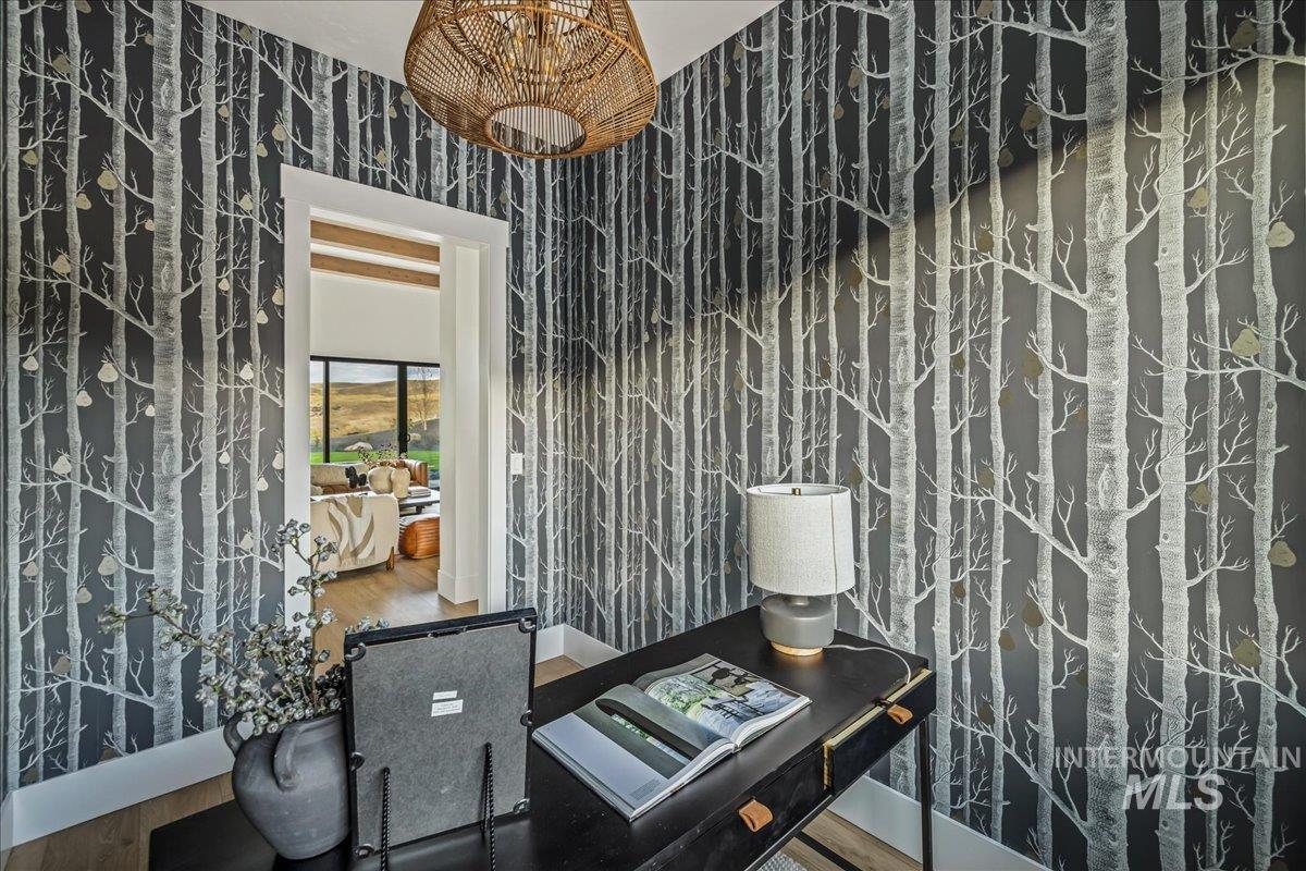 Bathroom featuring wallpapered walls