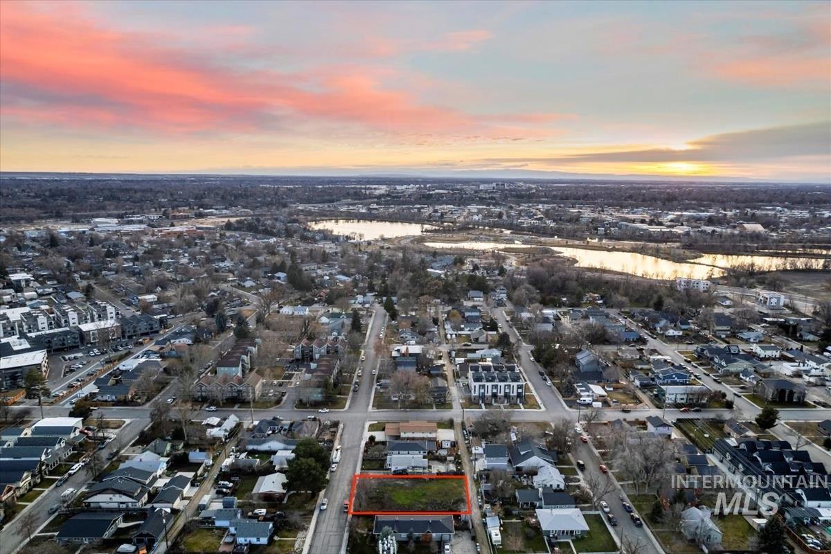 Aerial view of residential area with a large body of water