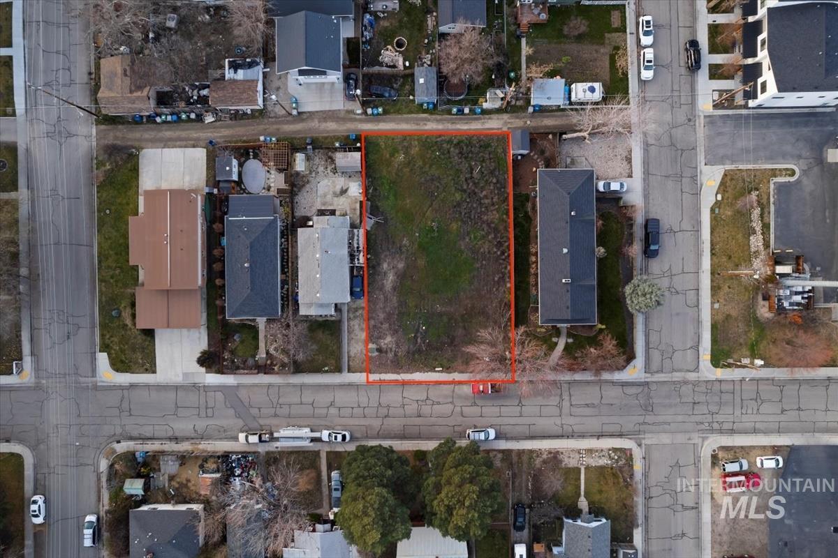 Aerial view of residential area with property boundaries highlighted