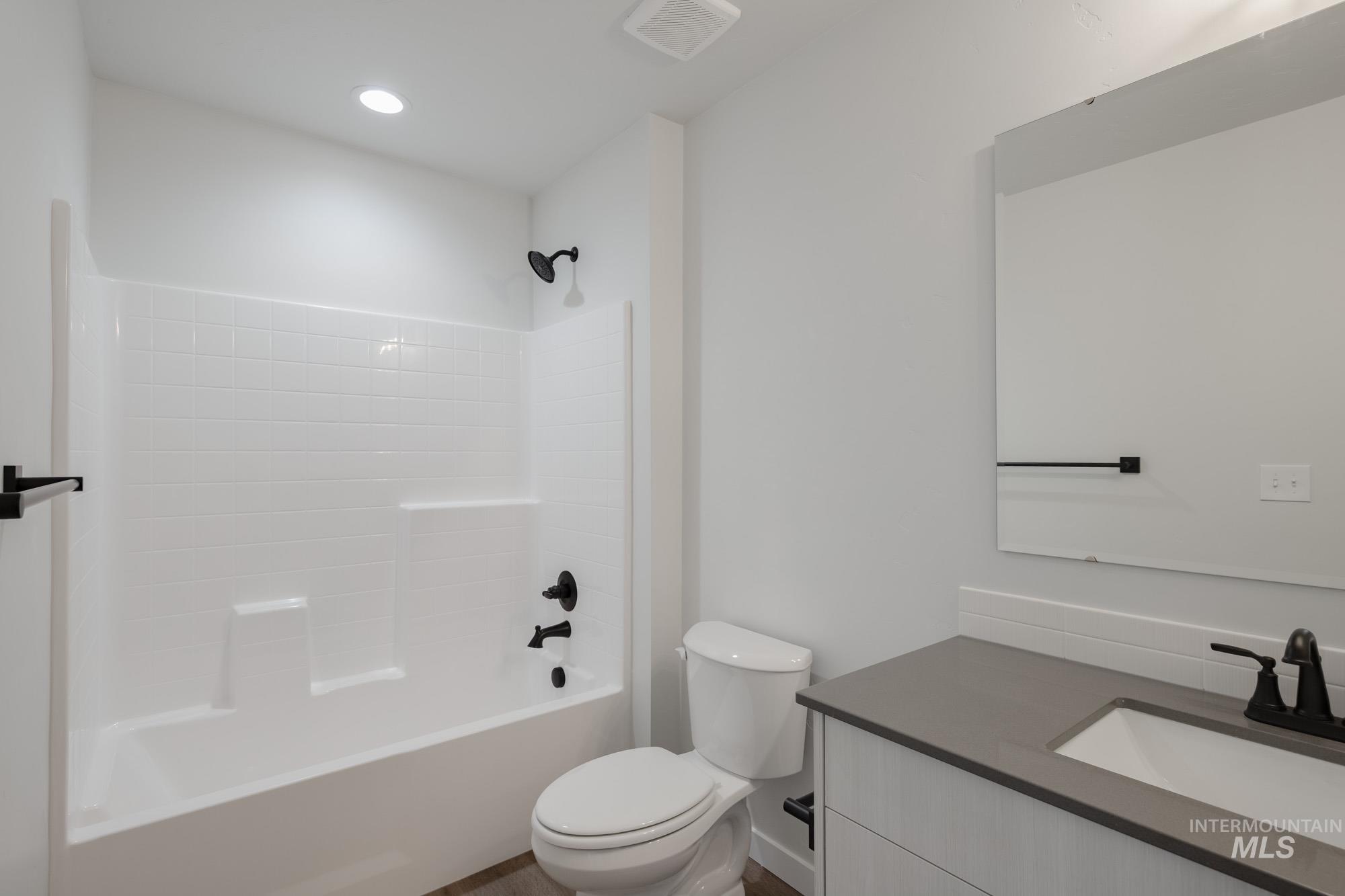 Full bathroom with vanity and tub / shower combination