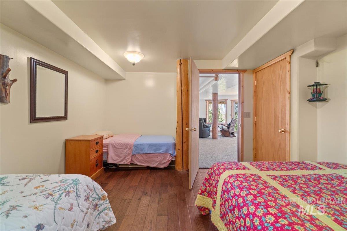 Bedroom featuring dark wood-style flooring