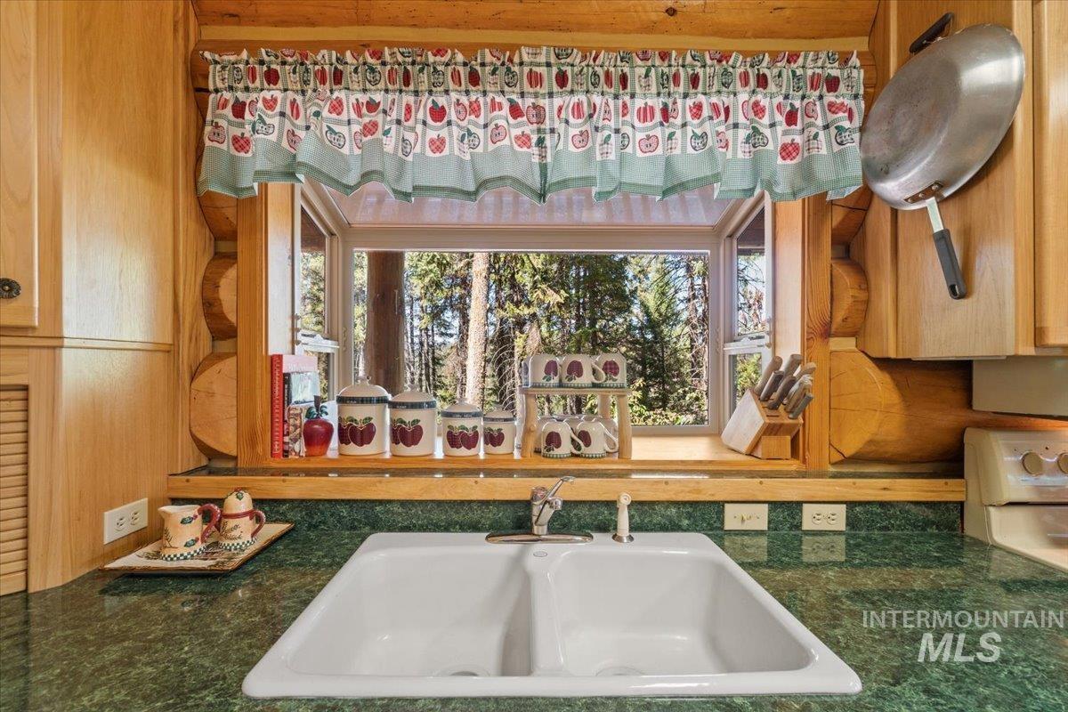 Kitchen featuring a sink and white range oven
