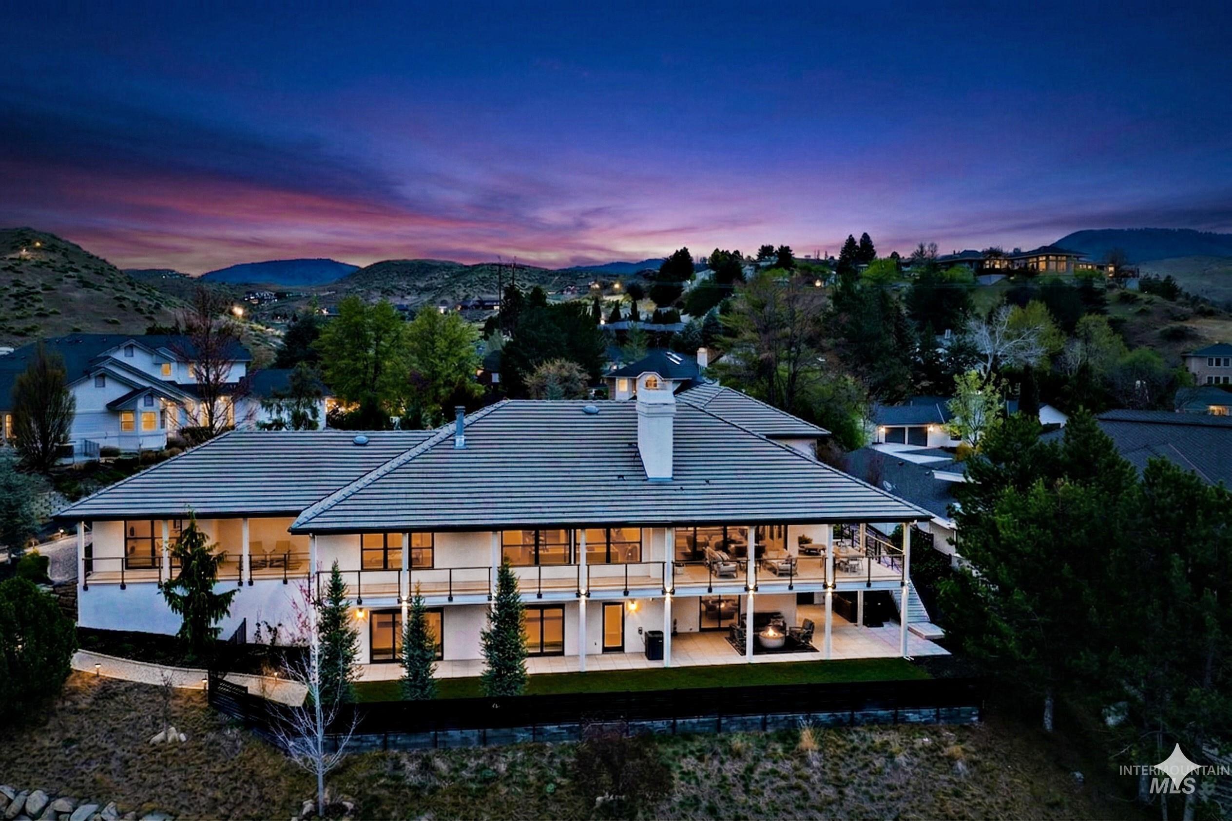 Two-story residence featuring extensive balconies and covered patios