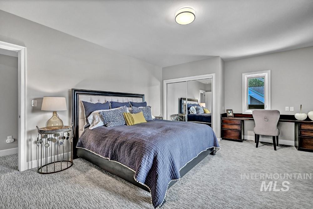 Plush gray carpeting throughout the room