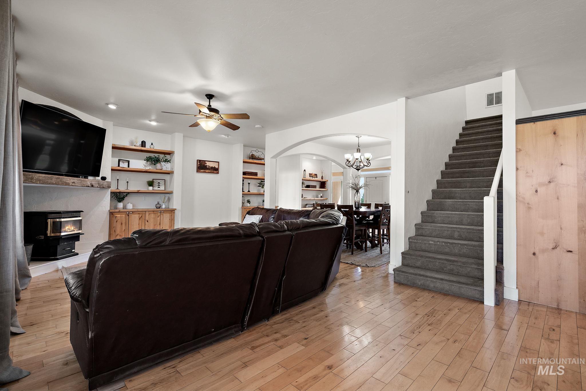 Living Room with first set of stairs that lead to 1st loft and bedrooms.
