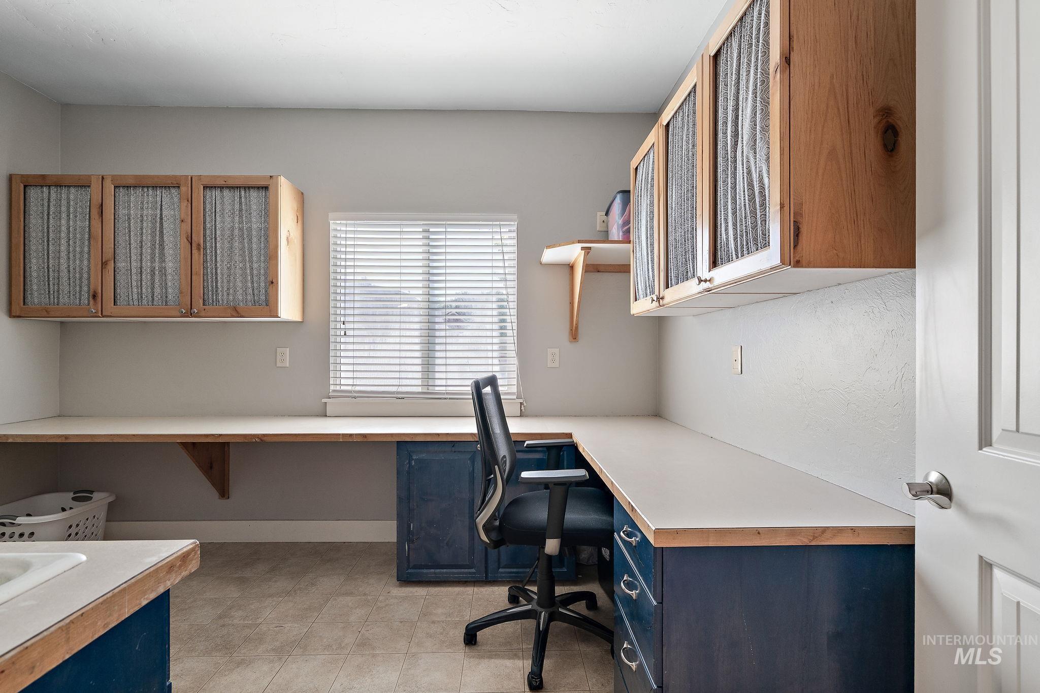 Laundry area with built in desk area.
