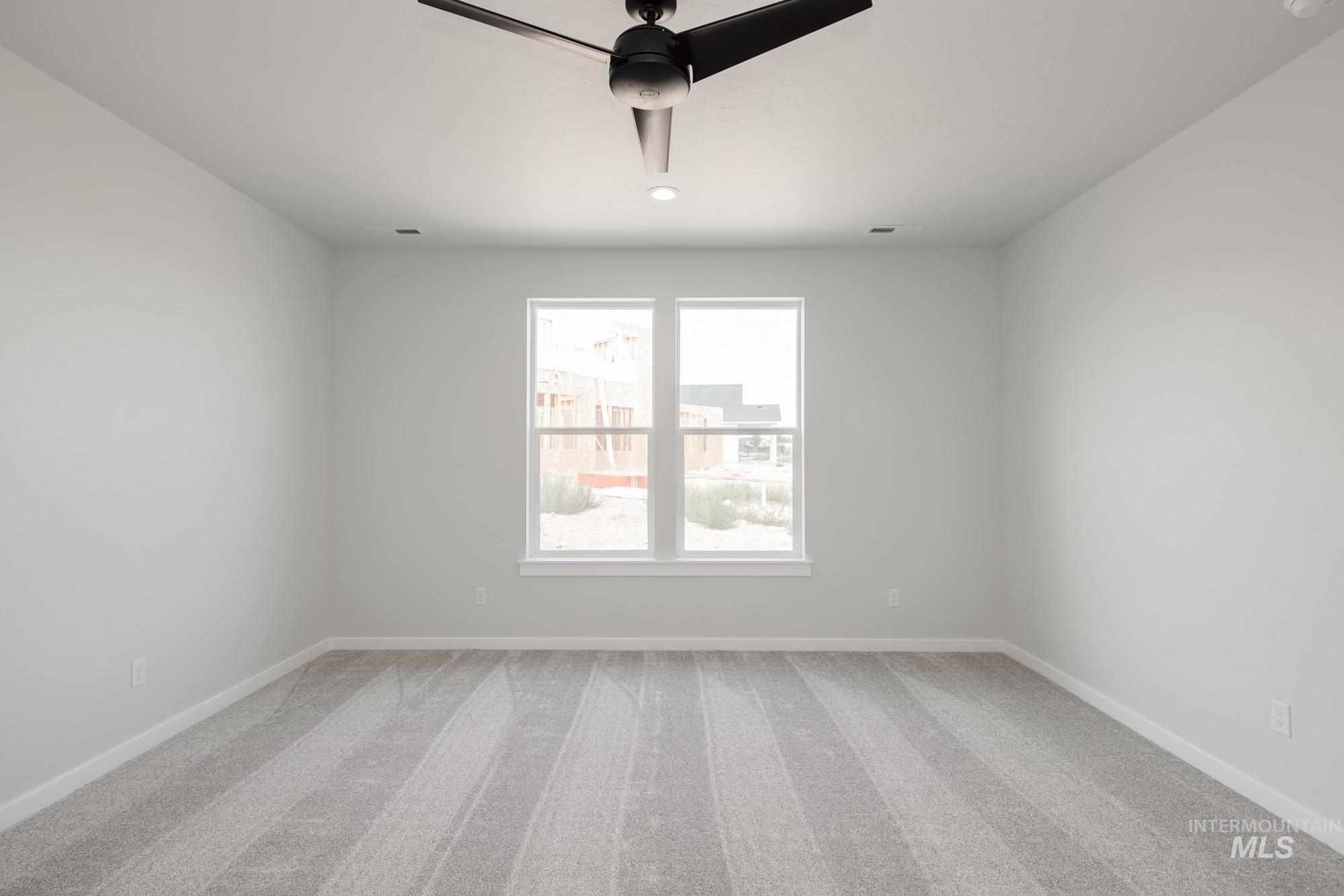 Unfurnished room with light colored carpet, ceiling fan, and recessed lighting