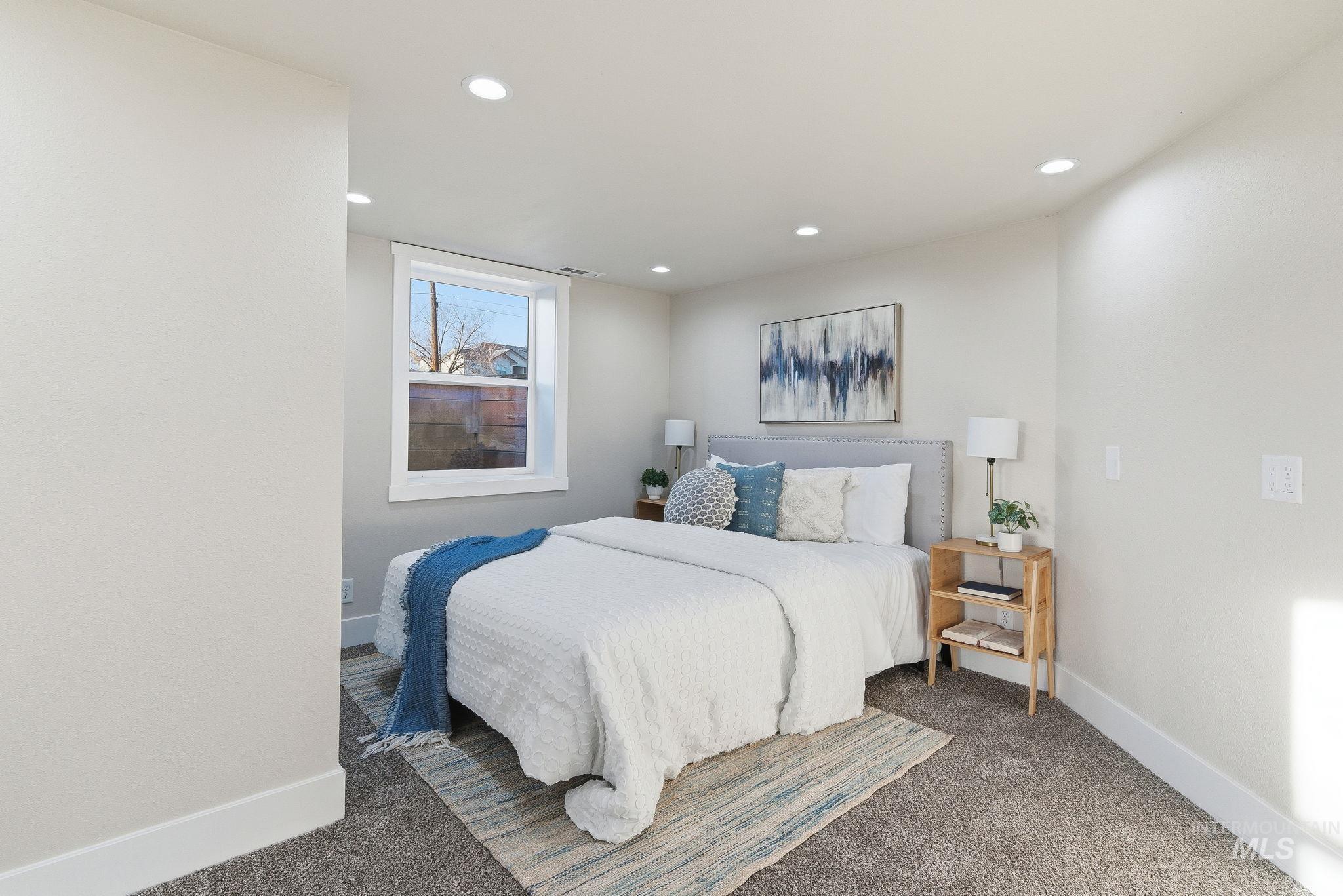 Carpeted bedroom featuring recessed lighting and baseboards
